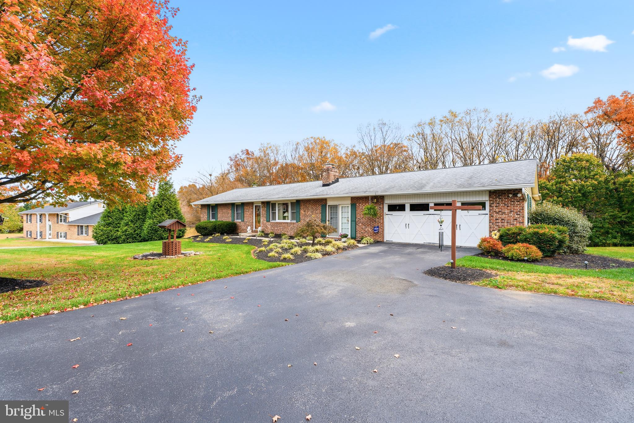 Welcome to 4145 London Bridge Road!
This charming brick-front rancher offers far more space than meets the eye — over 3,200 square feet of finished living area designed for flexibility, comfort, and entertaining. Nestled on 1.3 peaceful acres and backing to serene woods, it’s the perfect blend of privacy and natural beauty.
The main level of the home features a bright and flowing layout with three spacious bedrooms, including a primary bedroom with an ensuite bath and another full hall bath. A welcoming front living room, separate dining room, and kitchen with stainless steel appliances provide a warm and functional everyday space. Just off the kitchen, the expansive family room boasts a fireplace with a pellet stove insert, custom built-ins, and access to the porch connecting to the in-law suite.
A standout feature of this home is the private in-law suite, thoughtfully designed with its own living room, bedroom, full bath, and kitchen. With direct access from the main home via the enclosed porch, it’s ideal for multi-generational living, an au pair, long-term guests, or even a dedicated home office setup.
The finished lower level offers even more versatility, featuring a large recreation/club room with a brick fireplace and wood stove, a built-in tiki bar, half bath, laundry area, and a bonus room currently used as a walk-in closet.  Step outside to your private backyard oasis, where a concrete patio and saltwater pool offer the perfect retreat for relaxing or entertaining.