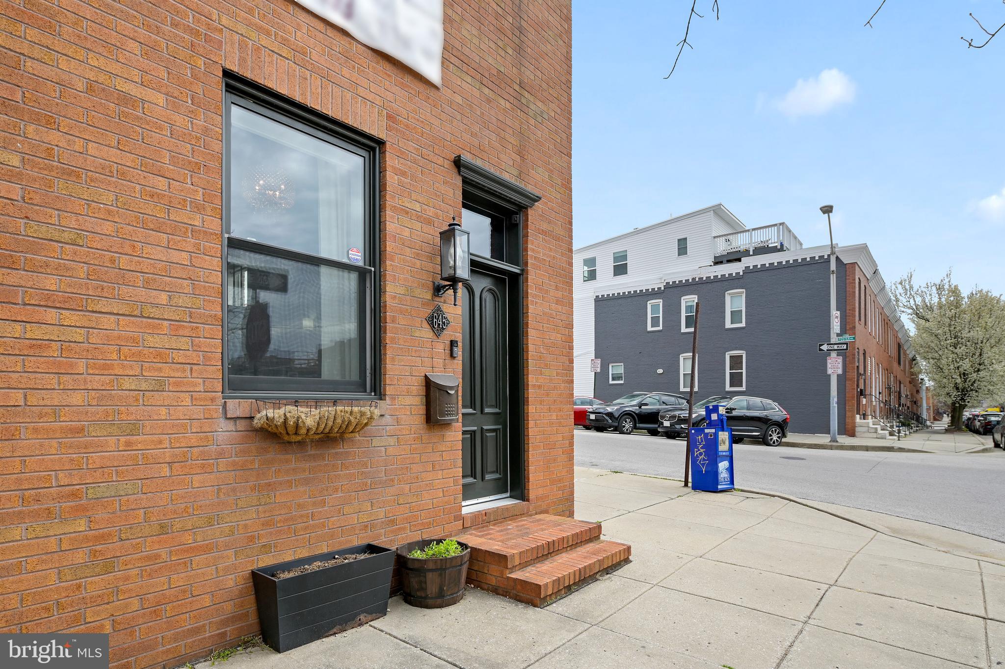 14 FT WIDE END OF GROUP CHAP RENOVATION LOCATED IN THE HEART OF CANTON! Extremely low taxes with a few years left on CHAP. This home boasts over 2,000 finished sq footage. Glistening hardwoods cascade throughout. Enjoy custom cabinetry, imported tile, marble countertops, designer lighting, and SS Bosch appliance package in the custom Chefs kitchen. Tons of natural light. High ceilings. Walk-in closets. First-floor office or workout room. Finished lower level with plenty of storage, full bath, and a custom wine cellar. 3 bedrooms are located on the second level. Easy access to a large rooftop deck from the hallway which is perfect for entertaining. Private parking pad. Close proximity to retail shopping, local dining, Patterson Park, Canton Water Front, and easy access to all major highways. Schedule a private tour today!