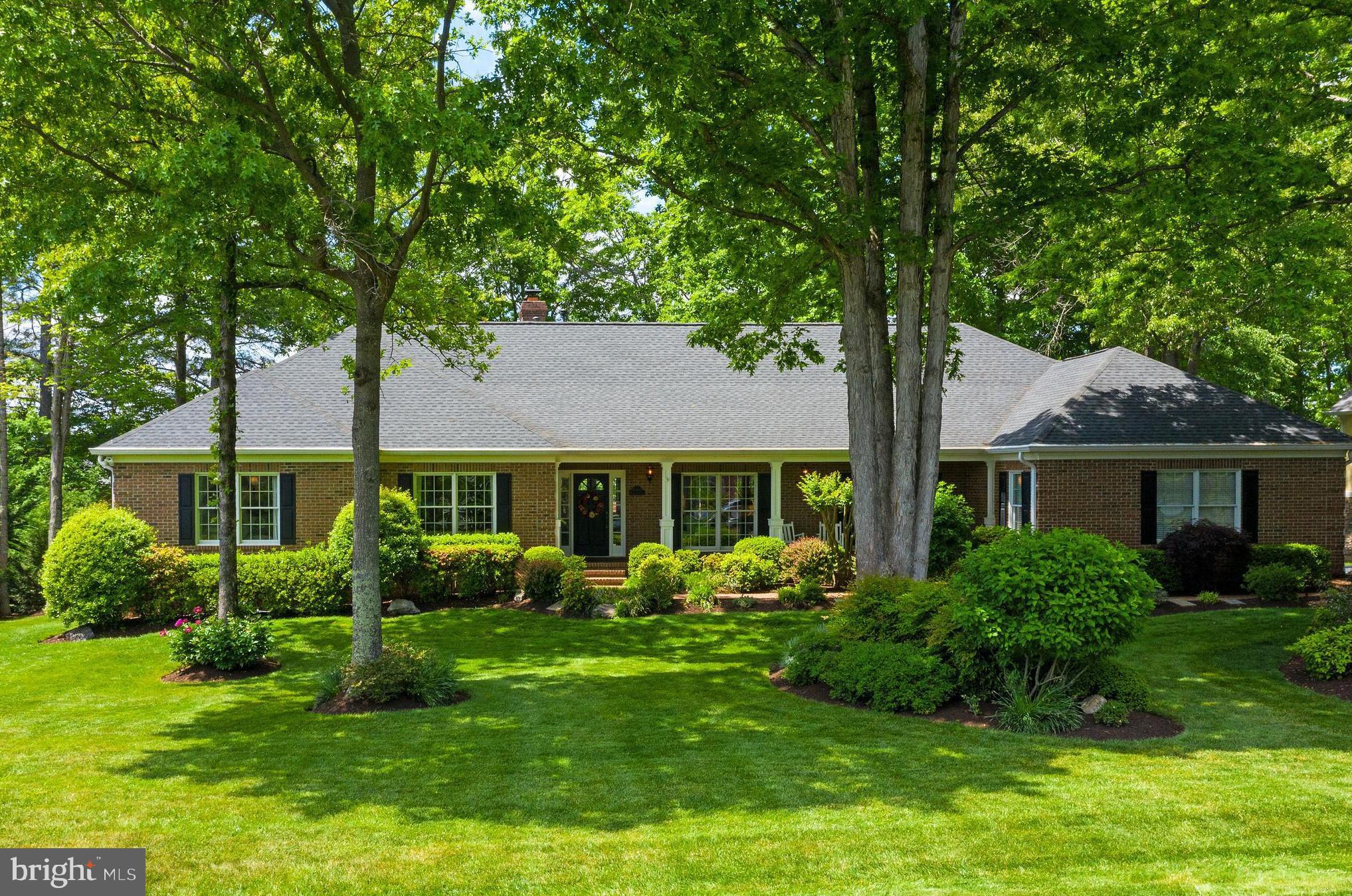 Waterfront Home in Fawn Lake, Wonderfully Updated and Move-in Ready!  This true lake home features stunning, wide water views from every room.   Uniquely situated to enjoy sunsets over the water from the rear of the home and sunrises while sitting on the covered front porch.  Nestled among mature trees, it offers a comfortable outdoor lakefront lifestyle all season long.  With 140' of bulk headed shoreline on pristine Fawn Lake, you'll enjoy swimming or sunning on the spacious dock with ample room to anchor your  boat.  This spacious  almost 6,000 sq. ft., all brick home has been masterfully renovated, removing and opening walls for a fresh, bright open feel.  New hardwood, carpet & tile flooring has been added, all four bathrooms have been remodeled and numerous other upgrades sprinkled throughout.  Breathtaking views of the lake are visible from the moment you enter the foyer, through the Great Room and Sunroom beyond.  Fabulous glass pocket doors open to the Living Room and formal Dining on the right before moving towards the magnificent open flow between the Great Room, Breakfast, Kitchen, Sunroom & Screened Porch.   An Office/Study has dual access from the Great Room and Hall, featuring more lake views & built-in  bookcases.  The Primary Suite is a sanctuary with soothing water vistas and access to the Screened Porch.  Enhancing the retreat are two walk in closets and a luxurious Bath featuring a soaking tub, frameless tiled shower, quartz vanity top and a heat lamp to keep you cozy.  Adding to the value, considerable flexible living space has been created in the fully finished, sunlit, walk out lower level.  Perfectly planned for many living situations, a newly added family room, sizable bedroom with walk-in closet and kitchenette can serve various purposes.   The generous Game Room area, Full Bath & Rec Room with access to the covered rear patio complete the finished space.  Storage options are plentiful in the lower level as well as the oversized 3-Car Garage with abundant shelving, utility sink and service door.  A newer roof and gutters, HVAC, appliances, lighting fixtures and more, add modern touches and peace of mind while irrigation drawn from the lake provides substantial savings and earth consciousness.  Across the cove from the Country Club, Golf Course, Community Clubhouse and Pool, this special home awaits it's new owners.