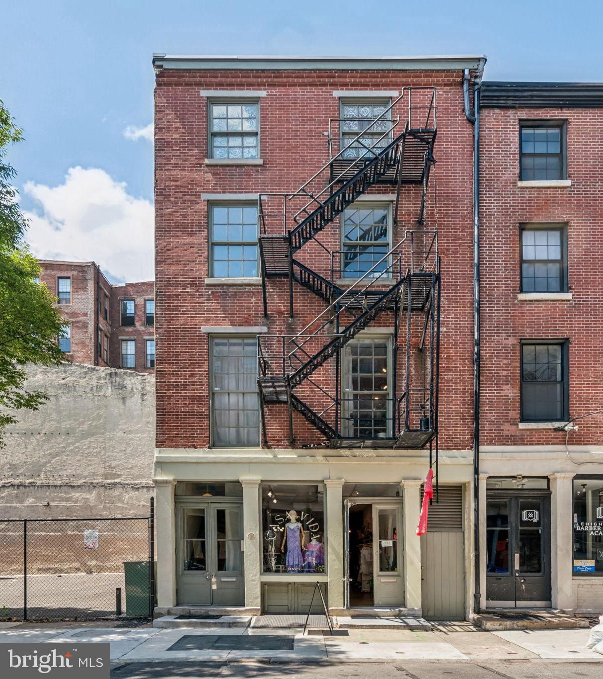 Rare opportunity to acquire this mixed use  Old City building with grand proportions, gorgeous apartments and story book ground floor retail space. Fully leased with long term tenants living in three exceptional self contained comfortably proportioned one bedroom apartments all with antique pine floors, wood burning fireplaces, W/D's and oversized baths. High ceilings, large windows and exceptional light. All utilities are separate with the exception of water.