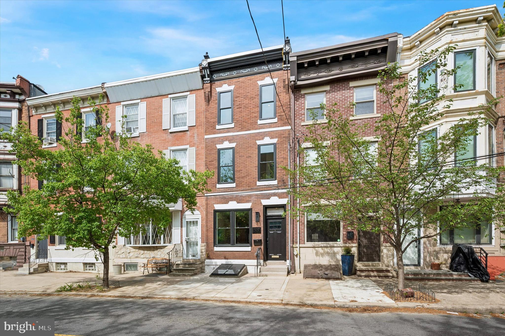 With desirable southern exposure, oversized windows fill the home with incredible natural light throughout the day, enhancing the bright, airy layout designed for both comfortable living and effortless entertaining.  Beautifully renovated, and perfectly positioned in the heart of Queen Village, this 3-bedroom, 2.5-bath home offers the ideal blend of modern style and city living.  Thoughtfully redesigned from top to bottom, every detail has been updated, creating a truly move-in-ready home with timeless appeal.

The interior features a bright and airy layout designed for both comfortable living and effortless entertaining. The expansive chef’s kitchen serves as the centerpiece of the home, offering generous space, stylish finishes, and exceptional functionality. Throughout the property, tasteful design choices and high-end touches create a polished, cohesive feel.

The partially finished basement provides additional living space, ideal for a media room, home gym, playroom, or office. Upstairs, well-proportioned bedrooms and beautifully appointed baths offer both comfort and sophistication. Above it all, the private roof deck showcases stunning skyline views, delivering the perfect setting for relaxing or entertaining.

Set just steps from Jon’s Water Ice, Angelo's Pizza, Italian Market, acclaimed restaurants, neighborhood parks, and charming boutiques, this home places you in one of Philadelphia’s most sought-after walkable and vibrant neighborhoods.