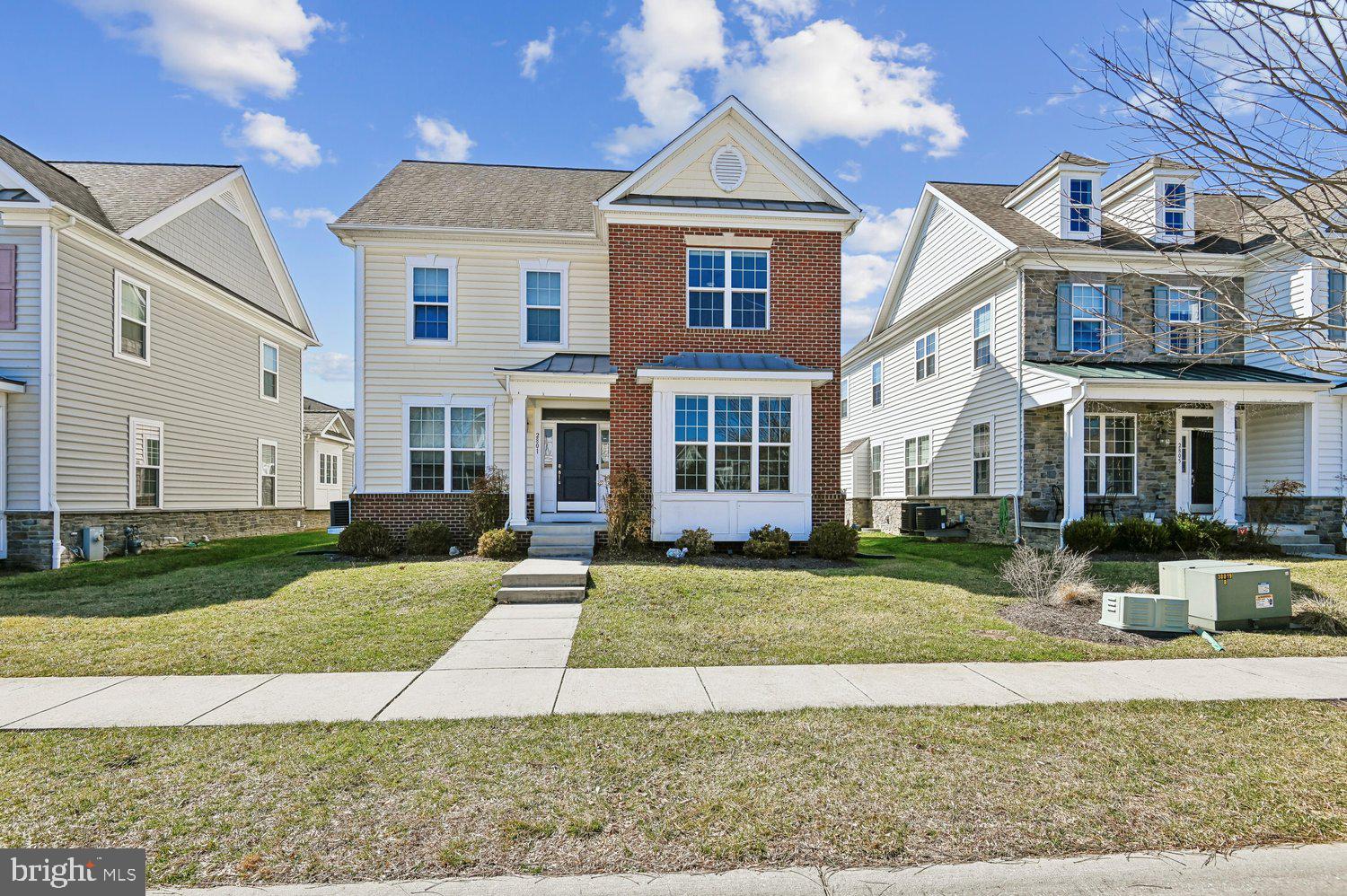 Nestled in the prestigious Villages at Turf Valley, this exquisite home embodies luxury and comfort. The traditional architectural style is complemented by a stunning brick exterior, inviting you into a world of elegance. Inside, discover a gourmet kitchen featuring upgraded countertops and high-end appliances, including a double wall oven and gas cooktop, perfect for culinary enthusiasts. The spacious family room, adorned with a cozy fireplace and mantel, seamlessly connects to the breakfast area, creating an ideal space for gatherings. With 4,066 sq. ft. of thoughtfully designed living space, this home boasts a primary suite with a luxurious bath and a Main level bedroom for your convenience. Enjoy the serenity of a fully finished basement, An Oasis for your enjoyment, featuring a full wet bar with built in beverage coolers,  media room for the perfect family movie night, and a home gym to stay in shape.  There is also a second home office in this lower level. Outside, the charming porch and well-maintained sidewalks enhance the community feel.  An attached two-car garage adds practicality to this stunning residence. Experience an exclusive lifestyle where every detail has been meticulously crafted for your comfort and enjoyment.
