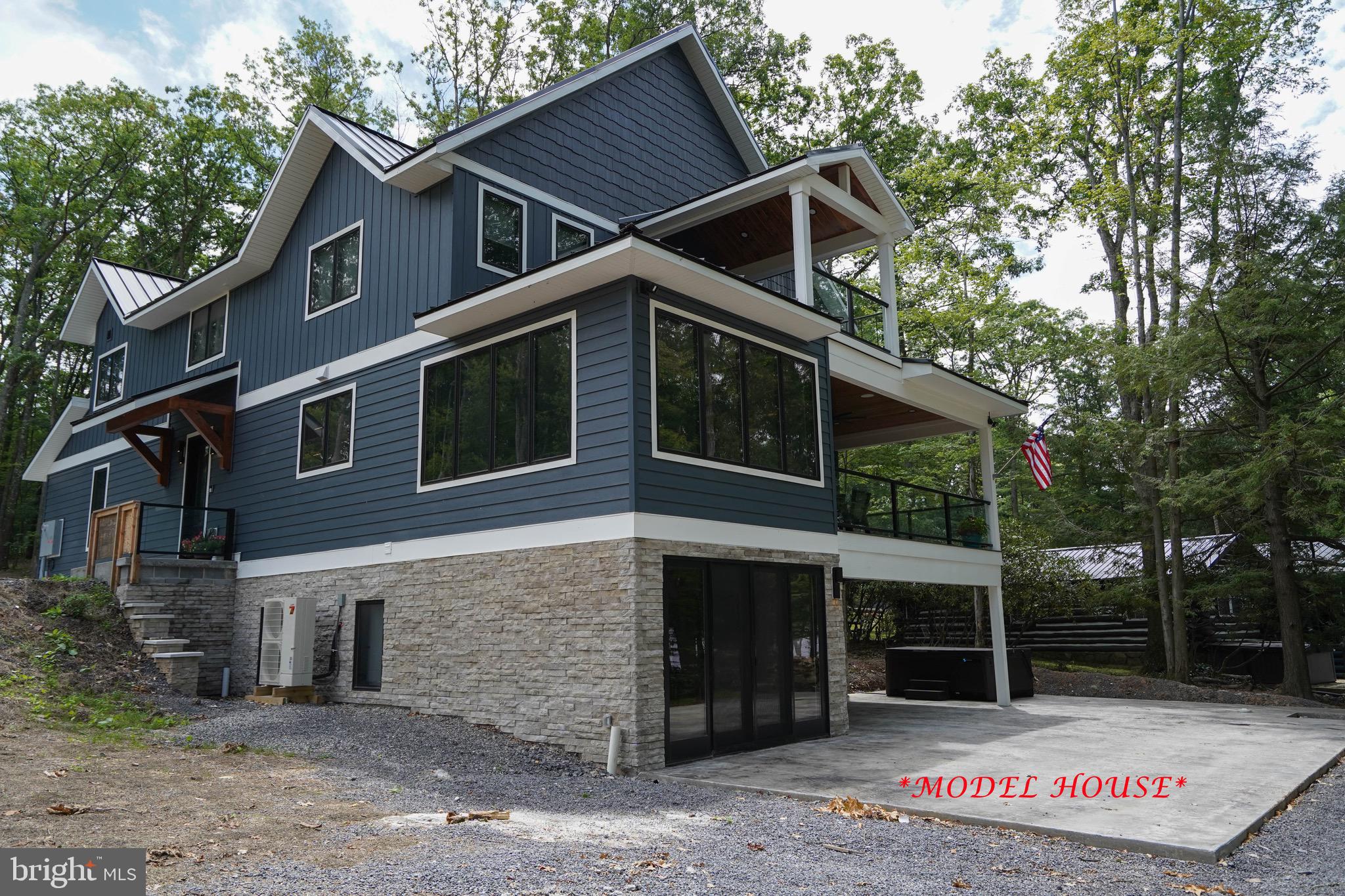 Construction to begin at settlement on this completely custom 5 bedroom, 3.5 bathroom lakefront home offering over 4700 square feet on a premium, 1/2 acre lakefront lot with 62' of lake frontage and 1 dock slip at a 2-slip common dock. Enjoy level lakefront with panoramic views and western exposure. Open main level layout that flows from foyer to living room, kitchen and dining that overlooks the lake through custom windows. The home pictured is a model home and is used to showcase the future home at 849 Glendale Road. Shared driveway entrance from Glendale Road. Call today for a private tour of this fantastic property!