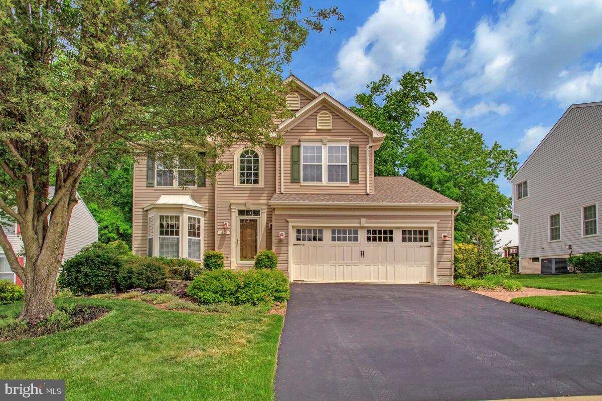 Amazing Opportunity on the Broadneck Peninsula! This meticulously cared for 4 bedroom, 3.5 bath Colonial features many special touches that make this house one of a kind. A beautiful bow window drenches the living room with natural light. Wood inlay flooring highlights the open dining area. The cook's kitchen features a granite countertop with breakfast bar, deep country sink, stainless appliances and bright eat-in area. A natural gas fireplace highlights the family room just off of the kitchen. The primary suite boasts a walk-in closet and large spa like bath with double sink and walk-in shower. 3 generous sized bedrooms and a full bath round out the upstairs. Main level laundry room. Hardwood floors, crown and chair rail molding, wainscoting and Plantation shutters are found throughout. The lower level offers a very large, finished living level with a full bath and 2 large storage areas. The expansive deck, perfect for outdoor entertaining and grilling, spans the rear of the house and steps down to a lovely paver patio perfect for Al Fresco dining!  The beautiful low maintenance landscape surrounds this home with natural beauty!