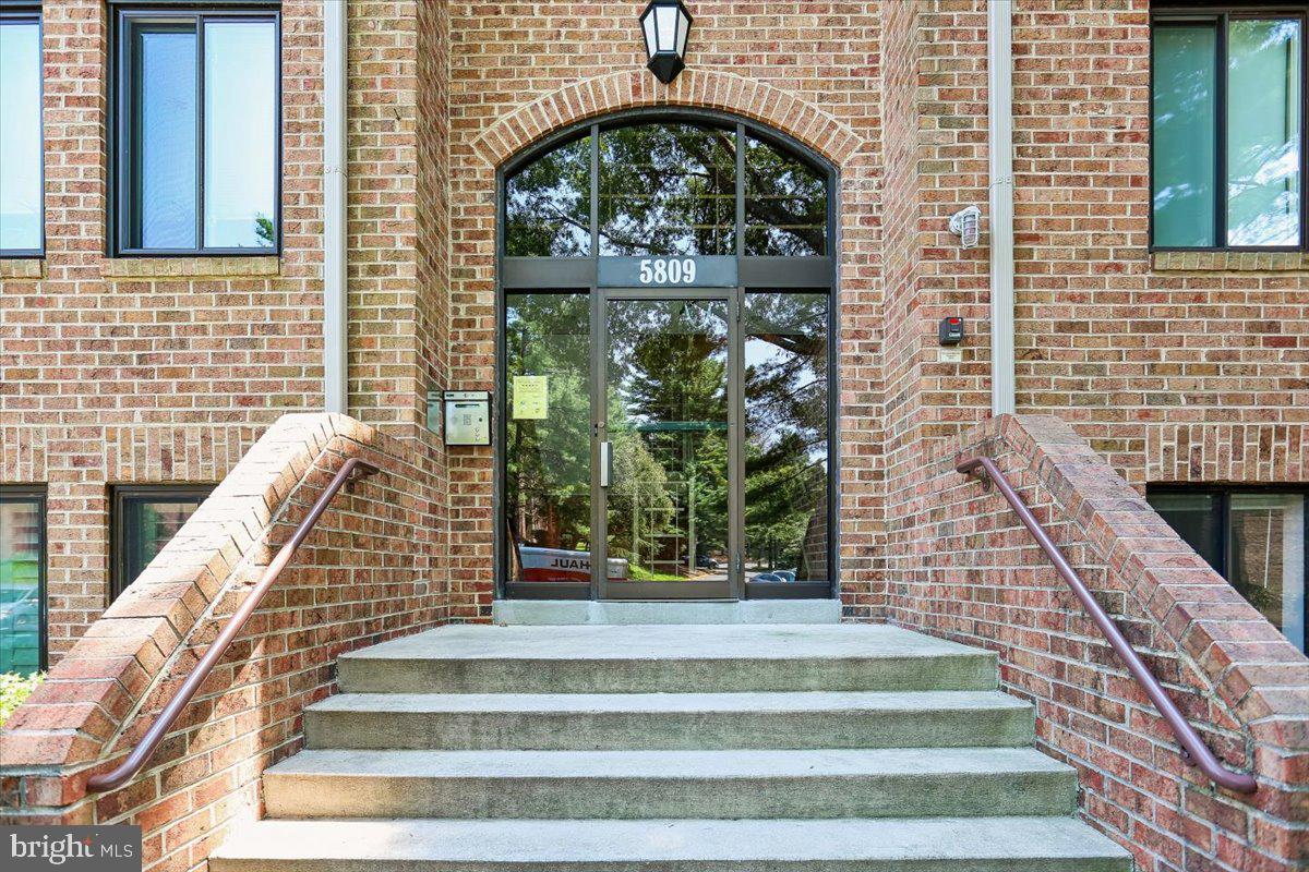 Welcome to 5809 Edson Lane, Unit T-4, a solid brick, freshly painted garden-style condominium with three bedrooms and two full bathrooms, located within the Walter Johnson school cluster. An entry foyer with a coat closet opens to a spacious living room with recessed lighting, parquet floors, and access to a private patio. The living room flows into a gracious dining room with a modern chandelier. The renovated table-space kitchen features granite counters, stainless steel appliances, and wood cabinetry. The generous primary bedroom suite includes wall-to-wall carpeting, a ceiling fan, a walk-in closet with an organizing system, and a private en-suite bathroom. There are two bright secondary bedrooms and an updated hall bathroom with a glass barn-style sliding door. The unit is complete with a linen closet and a laundry and storage room with a stackable washer and dryer.

Georgetown Village Condominiums offers a well-rounded set of amenities that enhance everyday living, including an outdoor swimming pool with a separate children’s pool, tennis courts, and a basketball court. The community also features a clubhouse and party room for gatherings, a playground, and landscaped grounds with walking paths. Additional conveniences include EV charging stations, ample parking with guest spaces, and on-site management. With its combination of recreational facilities and inviting common areas, Georgetown Village provides a comfortable, community-oriented lifestyle in a convenient North Bethesda location. This property is located near White Flint Metro, Pike & Rose, the Kennedy Shriver Aquatic Center, Whole Foods, Wall Park, Timberlawn Park, and Strathmore Concert Hall.