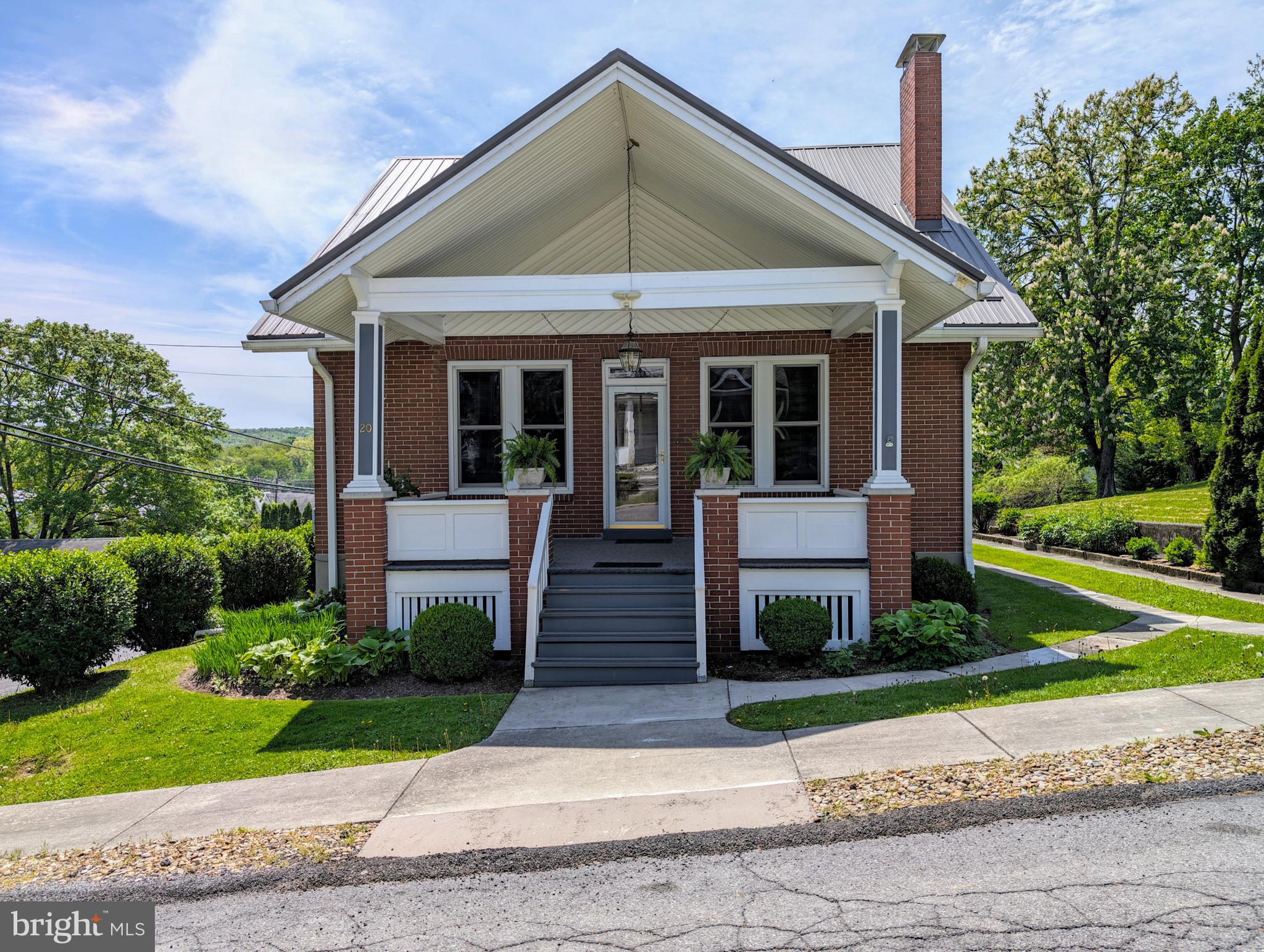 If you're looking for the ease of town living, but space enough for a yard, you've found your home. Located at 20 West 2nd Street in the great town of Everett sits a brick and vinyl cape cod that will wow you. This home has been meticulously cared for! Pristine oak and tile floors throughout entire home, and cherry built-ins give this home the warmth it deserves. A large covered front porch invites you into a cathedral ceiling of beautifully crafted wood. Three large ceiling fans to keep the air moving in any season, there's also a brick, wood burning fireplace to sit around when the air turns chilly. Original stained glass is the Devroe crest, that ordains the two side windows of the fireplace and haven't moved since their inception. They're a remarkable addition to the cherry built ins that surround the fireplace. Beveled windows throughout are also found on the french doors that open into the dining area. Glass door knobs are the exact character this home needs! A stately tiffany style chandlier hangs from the ceiling while custom blinds and valances sit atop bench built ins for added storage. Plenty of room in the kitchen for cooking and entertaining! The bar can accommodate high top chairs and overlook the kitchen. Black appliances look nice against the cherry stained oak, more custom blinds and valances and a newer garbage disposal. A garage door signal is located in the kitchen so you know if you accidentally left the garage door open! Step out onto the screened in 3 season room that also has an outdoor pantry. Off of the screened in porch is access to the terrace on top of the garage. Proper railing has been installed. Fill this with foliage and flowers and let it be your oasis! Back inside the home the first level offers a main bedroom with closet and its own french doors with access to the 3 season room. The main full bath carries on the cherry cabinets along with custom blinds, valance and shower curtain. Clean and impeccable!
A beautiful oak staircase will lead you to the two bedrooms that each have an alcove that overlook the back yard. All bedrooms with ceiling fans, closets, and the original oak floors. Second story full bath continues with the cherry cabinetry, tile floor, a Jacuzzi tub and stall shower. Laundry tubs and laundry area are located in the basement. A cedar closet, tons of storage area, a half bath and access to the integral garage that will fit one large vehicle or two smaller ones.  A new metal roof with 50 year warranty installed 2022; newer garage door, 2023 the front and back porch were painted and carpeted, and 2022 new water heater. Mature landscaping and ease of entry whether the front, side, back or through garage give you the access you need. This home is close to all the wonderful amenities that Everett has to offer. From walking distance to shops, eateries, gas and groceries, a library, banks, a barber shop, beauty shops, and doctors. Quiet and friendly neighbors are pivotal to loving your neighborhood and home and you will find that right here in the heart of 20 West 2nd Street, so schedule your tour today!