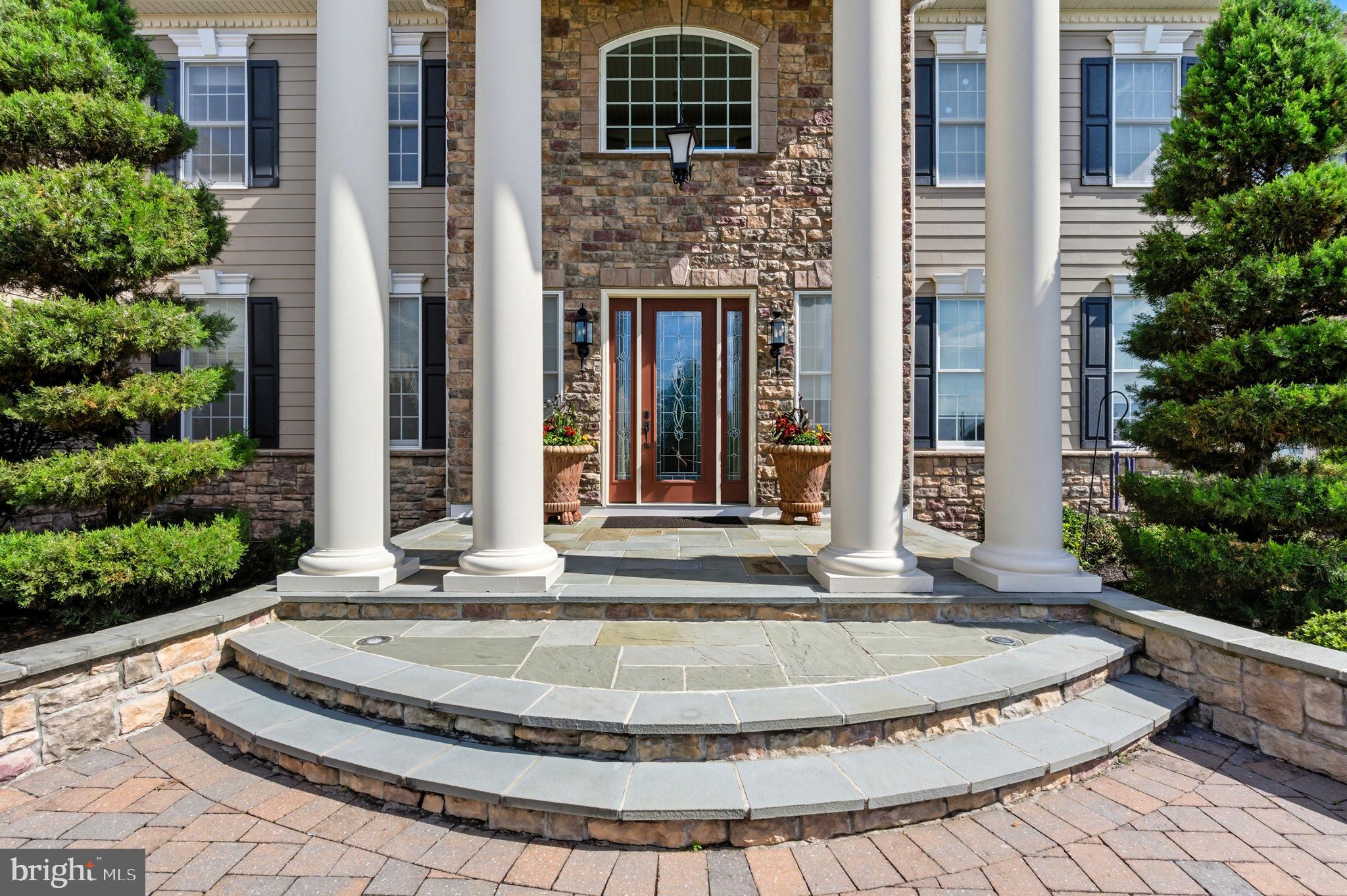 NOTICE: Days on market does not reflect actual marketing time. Property had been pending for 5 months and terminated due to Buyer financing/employment issues.

Welcome to this exceptional 5-bedroom, 4.5-bath estate, offering 6,584 square feet of luxurious living space, located on a quiet cul-de-sac in the coveted Chapman’s Corner community. Built in 2013 by Toll Brothers, this Henley Versailles model home features over $400,000 in premium upgrades, exquisite architectural details, and high-end finishes throughout.

A dramatic two-story foyer with dual curved staircases sets the tone for elegance and grandeur. Soaring 10-foot ceilings on the main level and 9-foot ceilings upstairs create an open, airy feel, complemented by oversized windows and custom millwork. Beautiful custom hardwood and tile flooring though out, including ceramic medallion in center of the foyer. The spacious two-story great room includes a striking 2 story stone fireplace, stunning “Coffered” ceiling, and flows beautifully into the heart of the home: a chef’s kitchen featuring rich wood cabinetry, granite countertops, a large center island, reverse osmosis water filter, subzero and professional-grade stainless steel appliances, walk-in pantry closet. The rear of the home was expanded during construction, to be even more spacious!

Retreat to the luxurious primary suite offering a bonus sitting room/office ,  3  walk-in closets, dual toilets, dual vanities, an ultra shower, and a whirlpool soaking tub. Off the primary bedroom is another huge bonus room. The four additional bedrooms include an en-suite and a Jack & Jill layouts, offering privacy and comfort for family or guests. A fifth bedroom or optional office/playroom provides flexible living space that features extra storage closet with built in cabinetry.

Designed for both work and play, the main level includes a dedicated office with custom built-in shelving, a gym/playroom, and a bright, window-lined conservatory. The custom 4-car garage features built-in shelving, cabinets for storage, and a specialized floor system - perfect for the car enthusiast or extra storage. A full basement provides endless possibilities, with high ceilings, rough-in plumbing for full bathroom, enabling future expansion. Walkout stairs provide added light and convenience.

Additional highlights include a whole-house generator, expansive private backyard, custom designed front hardscape walkway with special features including large decorative water fountain, artistic post lighting and additional accent lighting.  This home features full home security system with exterior cameras, and fire sprinkler system. This is an award-winning location in the Council Rock School District with an easy commute to Philadelphia, truly offering the perfect balance of luxury, space, and convenience. The lot boasts one of the best locations in “Chapman’s Corner,” a quiet cul de sac with expansive Bucks County views.