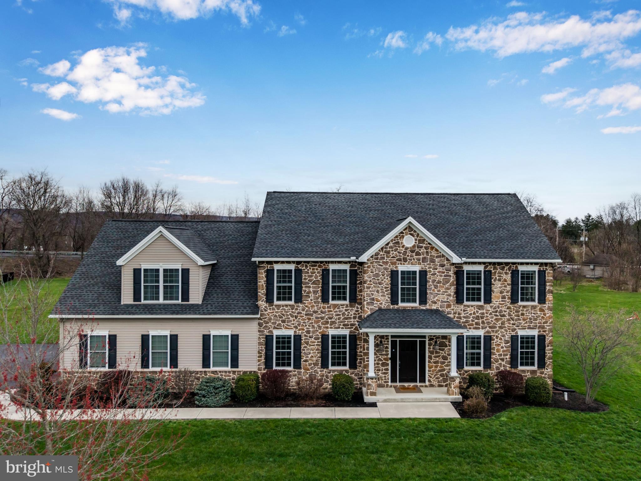 Welcome to this exceptional home tucked away in the desirable Hillside Farms community, within the sought-after Cumberland Valley School District. Situated on a private 1.59-acre cul-de-sac lot, this impressive residence offers more than 5,400 square feet of thoughtfully designed living space. With 5 bedrooms and 4.5 baths, the home blends comfort and sophistication at every turn. The fully finished lower level is perfect for entertaining, featuring a dedicated theater room, wet bar, full bath, and a private fifth bedroom, ideal for guests or as an in-law suite. At the heart of the home, the gourmet kitchen is designed to impress, showcasing an expansive granite island with seating, double ovens, a walk-in pantry, and a bright dining area. Just off the kitchen, the inviting keeping room offers a second fireplace, a custom-built buffet with a mini fridge, and direct access to the rear patio, creating a seamless indoor outdoor entertaining experience. The main level also features a spacious family room with fireplace and built-ins, a formal dining room, and a private office perfect for working from home. Upstairs, you’ll find four generously sized bedrooms, including a luxurious owner’s suite complete with a large walk-in closet and a beautifully appointed en-suite bath. One bedroom features its own private bath, while two others share a well-designed hall bath. Additional highlights include numerous upgrades throughout, efficient natural gas heat, and a prime location just minutes from the high school and Carlisle Pike for convenient shopping and dining. This is a home that truly has it all, schedule your private showing today.