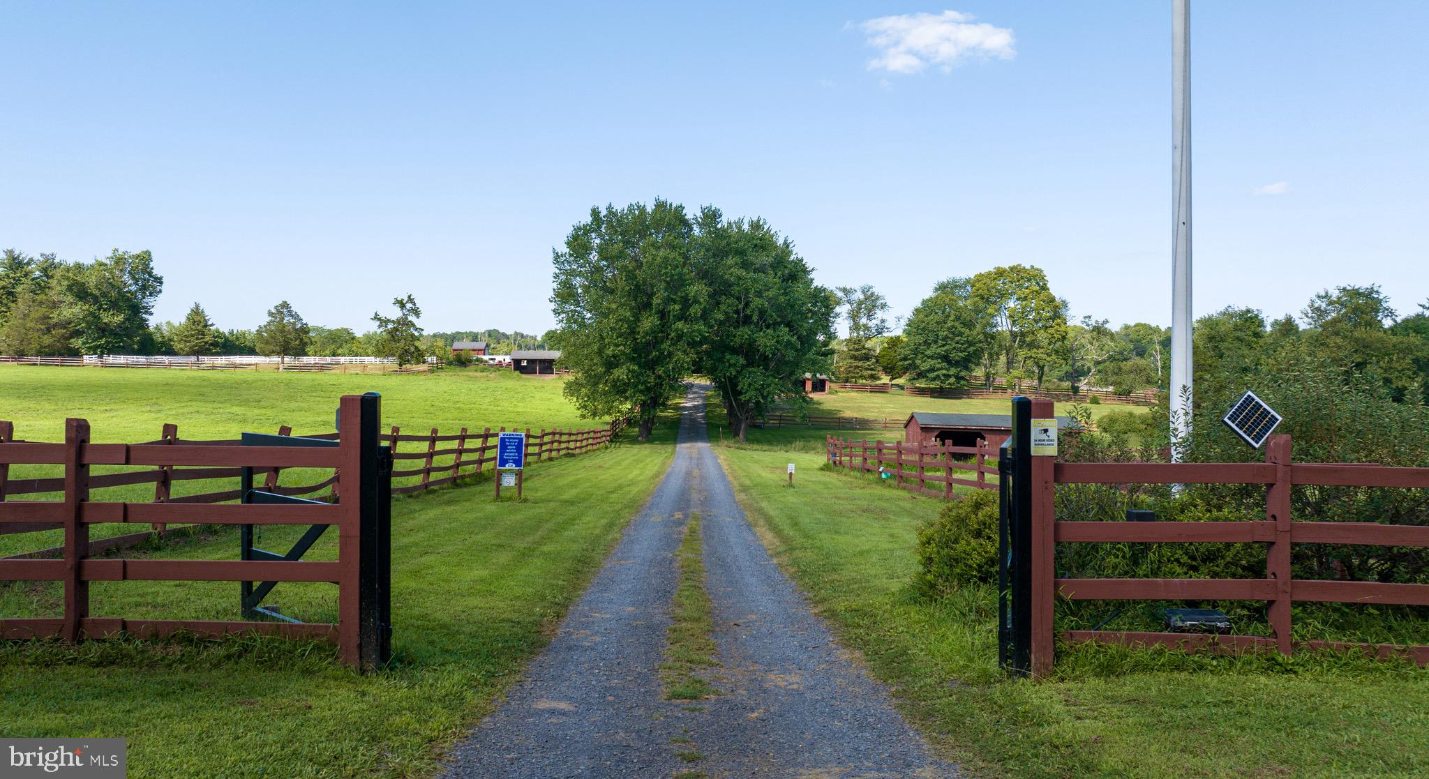 An Ideal Equestrian Opportunity on 22+ Acres

Set on 22.56 gently rolling acres in scenic Tinicum Township, this versatile equestrian property offers a rare blend of infrastructure, acreage, and potential in one of Bucks County’s most sought-after rural communities. Designed for serious horsemen and those with a vision, it’s well-suited for sport horse training, breeding, dressage, western programs, or a boutique boarding operation. The long tree lined drive brings you back off the road to a private estate space.

At the heart of the farm is a solidly built 18-stall masonry barn, designed with functionality and longevity in mind. A wide center aisle and lofty ceiling create a bright, airy environment. The barn includes a tack room, feed and grain storage, dedicated hay area, and a charming 1-bedroom apartment—perfect for staff or on-site management. There’s also a cozy lounge and full bath to support active use.

The land is fully open, with six thoughtfully laid-out, fenced pastures ready for turnout or rotation. A half-acre obstacle course adds a unique dimension, ideal for trail prep, western versatility, or desensitizing. Two round pens and a 200’ x 120’ outdoor ring are already in place, with room to expand further if desired.

Zoned for both agricultural and residential use, and free from HOA restrictions, covenants, or builder tie-ins, the property offers flexibility to develop. With township approvals, there’s ample space for a custom primary residence, indoor arena, or additional structures. The original vision included a main house to complement the barn—a concept still very much within reach for a buyer ready to make their mark.

Whether you're starting a boutique business, building a retreat, or expanding an existing operation, this is a property with promise—offering land, infrastructure, and unmatched potential in a highly desirable setting.  Ideal for the equestrian visionary ready to create something exceptional with your personal touch.