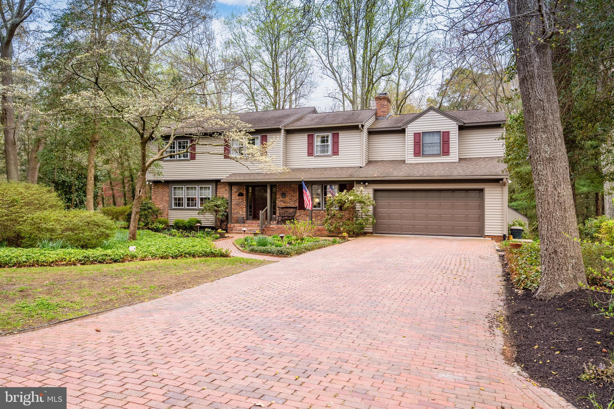 Nestled amongst mature trees in the desirable community of Tony Tank, you will find this 4 bedroom, 3.5 bath home with over 3,000 sqft of above ground living plus an additional approx 1,200 sqft partially finished basement. From the moment you arrive, the home welcomes you with timeless curb appeal - a brick driveway leading to a two car garage, hardscaped walkway, and a peaceful front porch perfect for sipping coffee. Inside, the layout provides both flexibility and comfort. Multiple seating areas include a cozy sitting room anchored by a wood‑burning fireplace. Toward the back of the home, the space opens into a bright, airy kitchen and dining area filled with natural light from expansive windows. Step directly onto the back deck for effortless indoor‑outdoor living and entertaining. The tree‑lined backyard offers privacy and serenity, along with a custom workshop equipped with electric—ideal for hobbies, storage, or creative projects. Back inside and headed to the second floor, there are 4 bedrooms. The primary bedroom is thoughtfully positioned at one end of the hallway for added privacy and includes an oversized primary bathroom and walk-in closet with custom organization. At the  opposite end of the hallway sits 3 generously sized bedrooms and a hallway bathroom. There is pull down attic with floored storage space. The full-sized basement is a true bonus - partially finished and equipped with heating and AC. At the bottom of the stairs sits the very large laundry room with exterior access to the back yard, ample storage space with shelving, and a basement refrigerator. Across the hall is a workshop space with workbench. Beyond that you will find approx 779sqft of finished basement space with another access point to the backyard. There is so much to enjoy about this home. Lovingly cared for by its original owners for more than 50+ years, this home radiates pride of ownership and timeless charm. Septic system was recently converted to public sewer, no city taxes! Come experience all it has to offer and imagine making it your own.