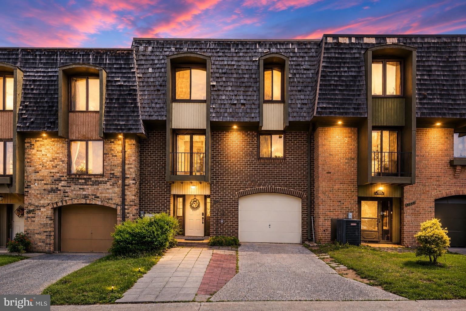 ***AMAZING NEW PRICE***Spacious and full of flexible living space, this 3-bedroom, 2.5-bath garage townhome in amenity-rich Montgomery Village offers great indoor-outdoor flow and room to spread out. The entry level features a welcoming foyer with coat/storage closet, garage access, and a separate bonus room with laundry—perfect for a guest space, home office, gym, playroom, or movie nights.

The main living level features a sunny updated eat-in kitchen with pantry and balcony access, a convenient half bath, separate dining room, and a spacious living room filled with natural light. Sliding doors off the dining room lead to a composite wood deck with stairs down to the fenced patio and landscaped backyard, creating the perfect setup for entertaining or relaxing outdoors.

Upstairs, the spacious primary suite features a dressing area with an extended vanity and sink, closet, and linen closet, with the shower and toilet set separately for added functionality and privacy. Two additional bright bedrooms and a chicly renovated hall bath complete the upper level.

Additional highlights include a brand-new HVAC system (2026), Smart Home System, electric car charger, one-car garage, two-car driveway parking, additional parking directly out front, and a 2-year-old washing machine. The entry-level bonus room has a rough-in to add a bathroom. Enjoy all that Montgomery Village has to offer, including pools, tennis courts, walking paths, parks, lakes, shopping, dining, and convenient access to major commuter routes.