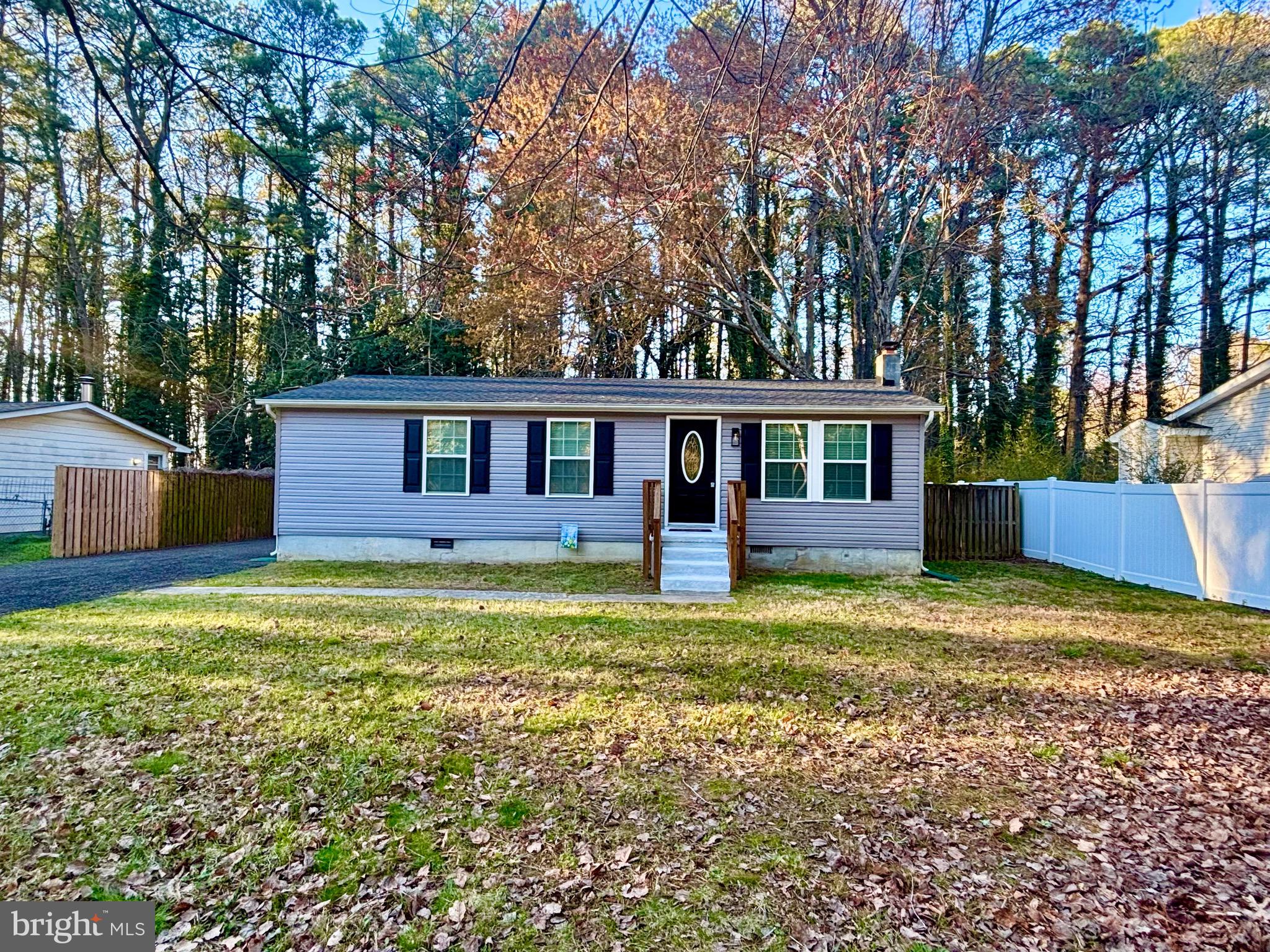Seller will pay $5k towards buyer's closing costs! Major renovations throughout 2025 and just completed in 2026! Some of the renovations include a new roof, siding, shutters, sliding back door, 6-panel grid windows, whole house water filtration system, and a fully encapsulated crawl space. With all of the major exterior renovations completed, step inside to find an inviting open floor plan adorned with durable waterproof luxury vinyl plank flooring throughout, perfect for both entertaining and everyday living. The living room, conveniently located off the kitchen, creates a warm atmosphere for gatherings and relaxation. The spacious kitchen features white shaker soft close cabinets, granite countertops, modern matte black fixtures, a stylish island and energy-efficient stainless steel appliances, making meal prep a delight. This home boasts single level living with three cozy bedrooms, including a well-appointed full bathroom with a tub/shower. Enjoy the convenience of a seperate laundry and utility room, ensuring that chores are a breeze. Outside, the expansive back deck invites you to savor morning coffee or evening sunsets. The serene level backyard shines with a fully fenced-in privacy fence, ideal for outdoor activities or peaceful retreats. Additional features include flood lights for security and a handy shed for extra storage. As part of the Drum Point community, you'll have access to fantastic amenities such as a beach, boat dock/slip, and common grounds, enhancing your lifestyle with recreational opportunities. This home is not just a place to live; it's a gateway to a vibrant community and a fulfilling lifestyle. Don't miss your chance to make this gem your own!