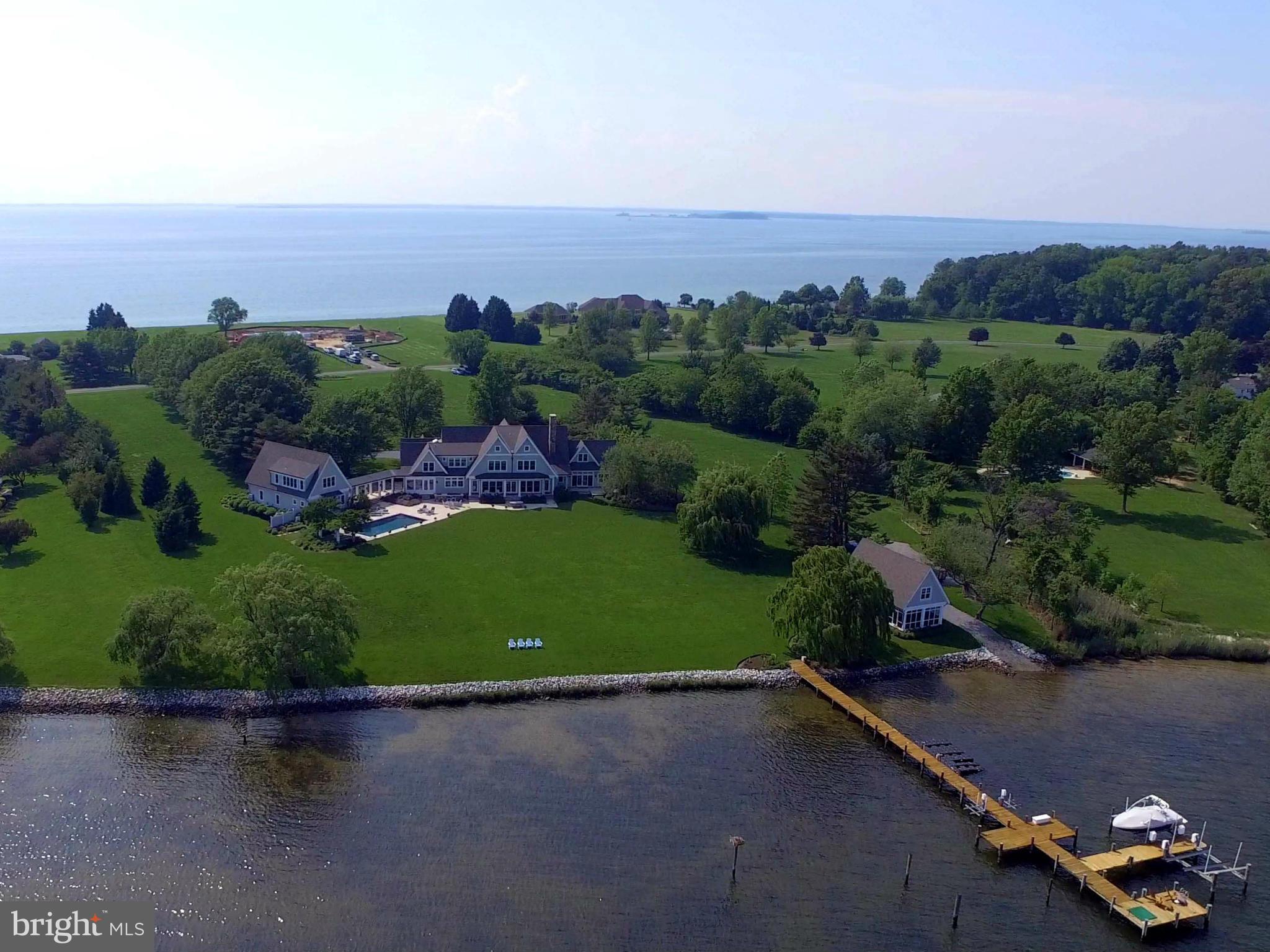 Welcome to Maryland's Eastern Shore. Custom designed home by Hammond Wilson Architects & Pyramid Builders. This breathtaking 6 acre lot nestled along a peninsula on the Wye River provides the perfect location.  Master suite on  main level, 3 more suites, extra bedroom, gourmet kitchen. Guest House, Boat house,pool, deep water private pier on the Wye and  more. Call for private tour.