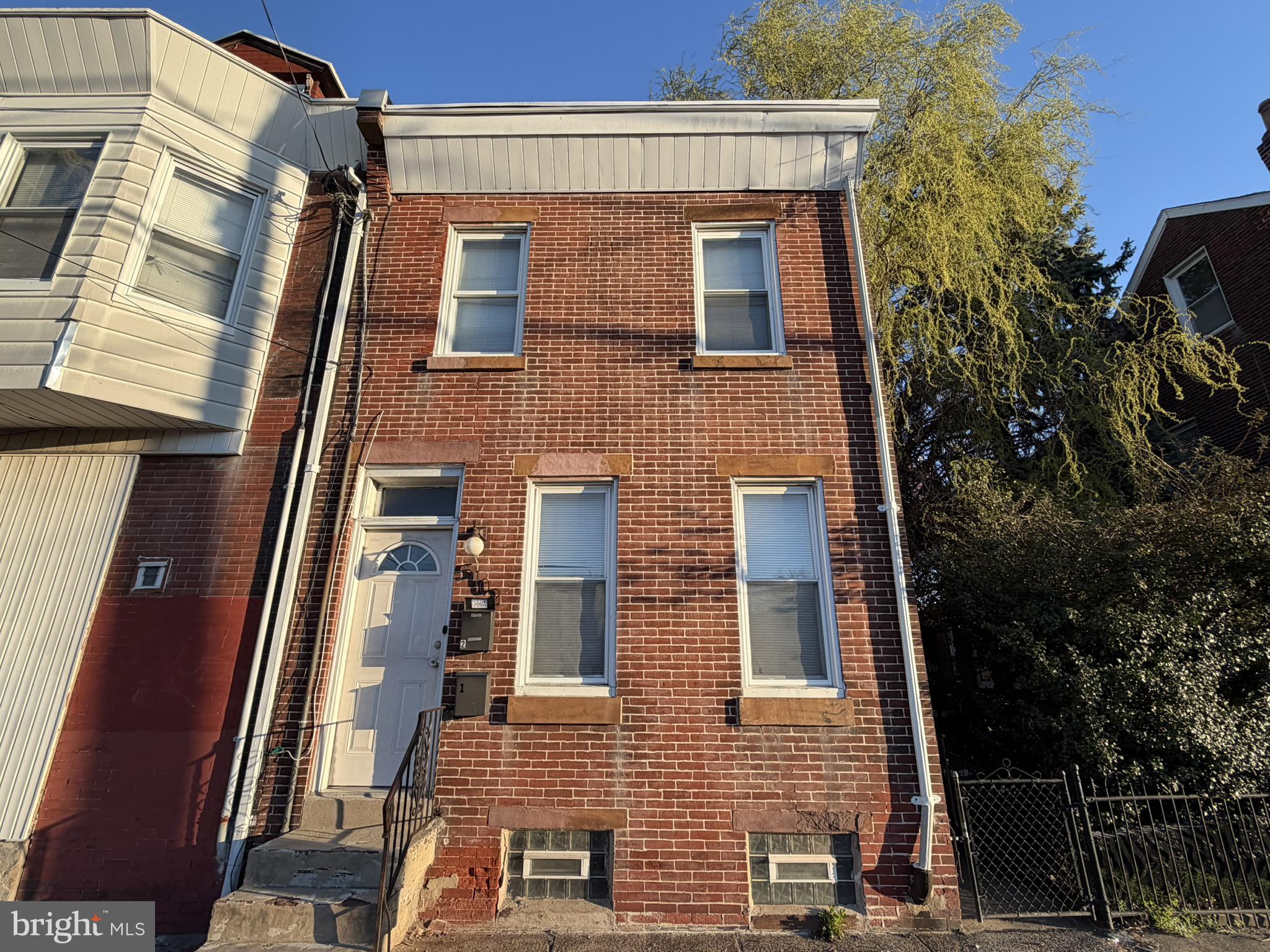 Built in 1945, this semi-detached row style multi-unit (2-unit) property features a solid brick construction, ensuring durability and low maintenance for years to come. Its interior was updated and modernized in the recent past. Great for investor or owner occupant who rents the second unit for additional income.  The property spans 1,502 square feet, offering two apartments, 825 Sq ft and 700 Sq ft respectively and providing ample space for tenants while maximizing rental income potential.  First floor has 9’2” ceiling height, living room, dining room,  kitchen and bedroom with laminate flooring, ceiling, fan, and abundant light. The bathroom has set in tub as well as ceramic tile surround. The first floor unit has rear door to rear yard and inclusion of the basement. The Basement has 6’2” ceiling height, is full and unfinished with cement floor and parged rubble stone walls. Utilities include 2 electrical meters, 1 public water meter, 2 gas meters, 2 Bradford White hot water heaters (2020 & 2023), 2 Weil-McLain gas-fired hot water boilers, and laundry hookup and utility sink present. The Second Floor Unit has private entry from Torresdale Avenue (first level access with private hallway), 8’6" Ceiling Height, Living Room, Kitchen, 1 Bedroom, 1 Bathroom. Located in a vibrant neighborhood, this property is poised for growth, making it an ideal addition to any investment portfolio. The potential for appreciation in value, combined with the steady demand for rental units, positions this property as a smart choice for savvy investors looking to capitalize on the real estate market. Overall rental rate range per unit is between $750 and $1,250. In current condition rents are estimated to be between $800 and $900. If unit is refreshed with paint and carpeting, estimate rents ae between $900 and $1,200. Seize this opportunity to invest in a property that combines comfort, convenience, and financial growth.