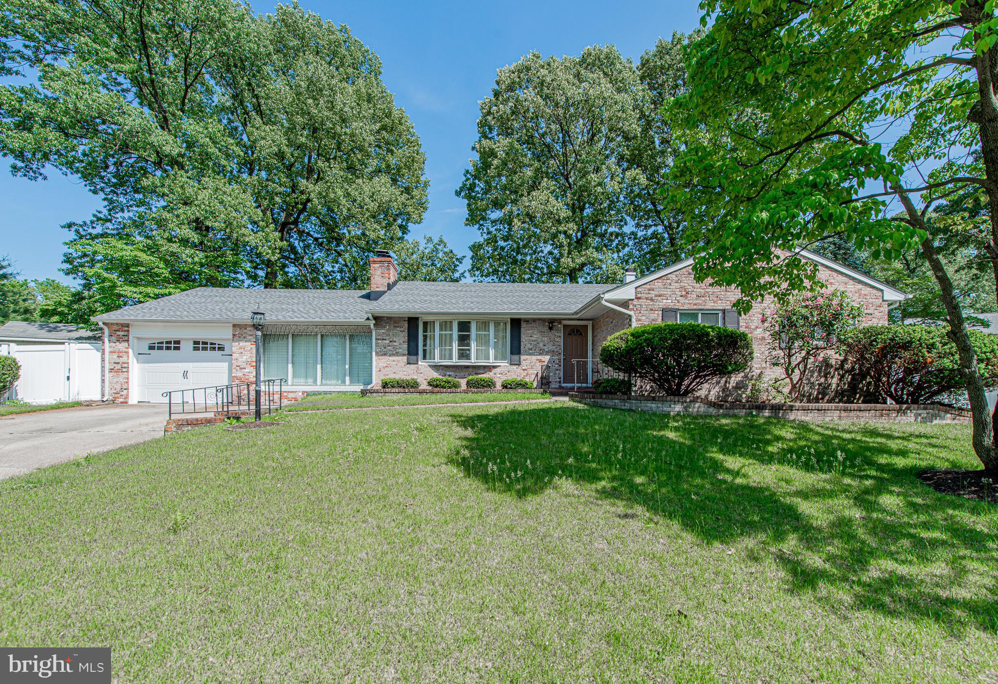 Stunning elegant brick rambler with garage on level cul-de-sac lot. Gleaming hardwoods throughout main level. Remodeled kitchen w/cherry cabinets and neutral counters-room for eat-in kitchen but has formal dining room. Sensational sunroom with crank-out windows and built-in BBQ for fun entertaining-another outside bbq and patio. Freshly painted, new roof, new garage door-fabulous, fenced rear yard, all appliances!