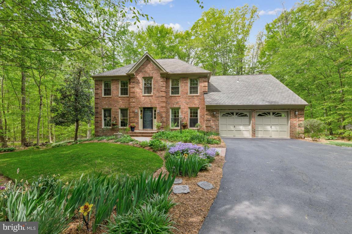 Under contract! Open houses canceled. ** Check out 3-D tour. **Nestled on a 1.16-acre wooded lot in Ardmore Woods, this property is a certified National Wild Life Foundation landscaped property, including a 2020 rain garden Virginia Soil and Water Conservation District certified design. Evenings glow with smart exterior lighting, elegantly illuminating the winding driveway and home for stunning curb appeal and enhanced security. Built in 1987 by Scarborough, now Tri Pointe Homes, this Coventry model offers the perfect blend of comfort, privacy, and thoughtful upgrades. Freshly painted on all three levels and new carpeting on the upper and lower level this home is refreshed and ready to go. The main level features an impressive 2-story foyer, updated lighting, crown, chair, and box molding. Please see the floor plan for the layout. Living areas include a private office, formal living and dining rooms, as well as the open kitchen  with breakfast room. The family room, with the propane gas fireplace, impressive vaulted ceiling and French doors to the extensive decking features a window seat bay window overlooking the wooded yard. The multi-tiered deck includes a propane hook up for grilling. Additional outdoor living spaces included the screened gazebo, recirculating ponds with stream, and slate patio off the recreation room.  The huge mudroom leads you from the kitchen to the 2- car oversized garage with side entrance. Upstairs the primary suite is it's own wing featuring a sun-lit sitting area with glass French doors, dressing area with two walk-in closets, heated ceramic bathroom tile floors, granite dual sink vanities, walk-in shower and jetted tub with picture window. The 2020 updated upper hallway bath boasts a luxurious soaking tub and a sleek walk-in shower, blending elegance with modern comfort. Retreat to the basement which is perfect for exercising, movies and gaming complete with surround sound speakers. The fifth bedroom features proper egress and two closets. There is a full bathroom. Plenty of storage in the store room.  Walk-out to the slate patio. **Mechanical Information: 2020 new upper and lower units - main level system is up to 24 SEER with 4 ton air handler, second level system is 18 SEER with 3 ton handler with 2-zones - all with smart controlled thermostats. 2023 new 55 gallon water heater. 2020 new blown-in 18" insulation in attic. 2024 picture window in primary bathroom. 2021 Sump pump and  Ejector pump system replaced. Radon mitigation system present. 2017 dining room picture window. 2020 new exterior side entry door to garage. 2020 soffit and trim replacement. 2022 new double pane energy efficient windows in basement storage area. Refrigerator 2023, dishwasher 2021, Washer/dryer 2016.  ***Located off the Fairfax County Parkway and scenic Clifton Rd, it is convenient to Burke Lake Park, the Historic Town of Clifton, and key commuting routes including 10-minutes to the Burke VRE and just 17-miles to Washington DC . ***Zoned for FCPS Robinson Secondary and Fairview Elementary schools.