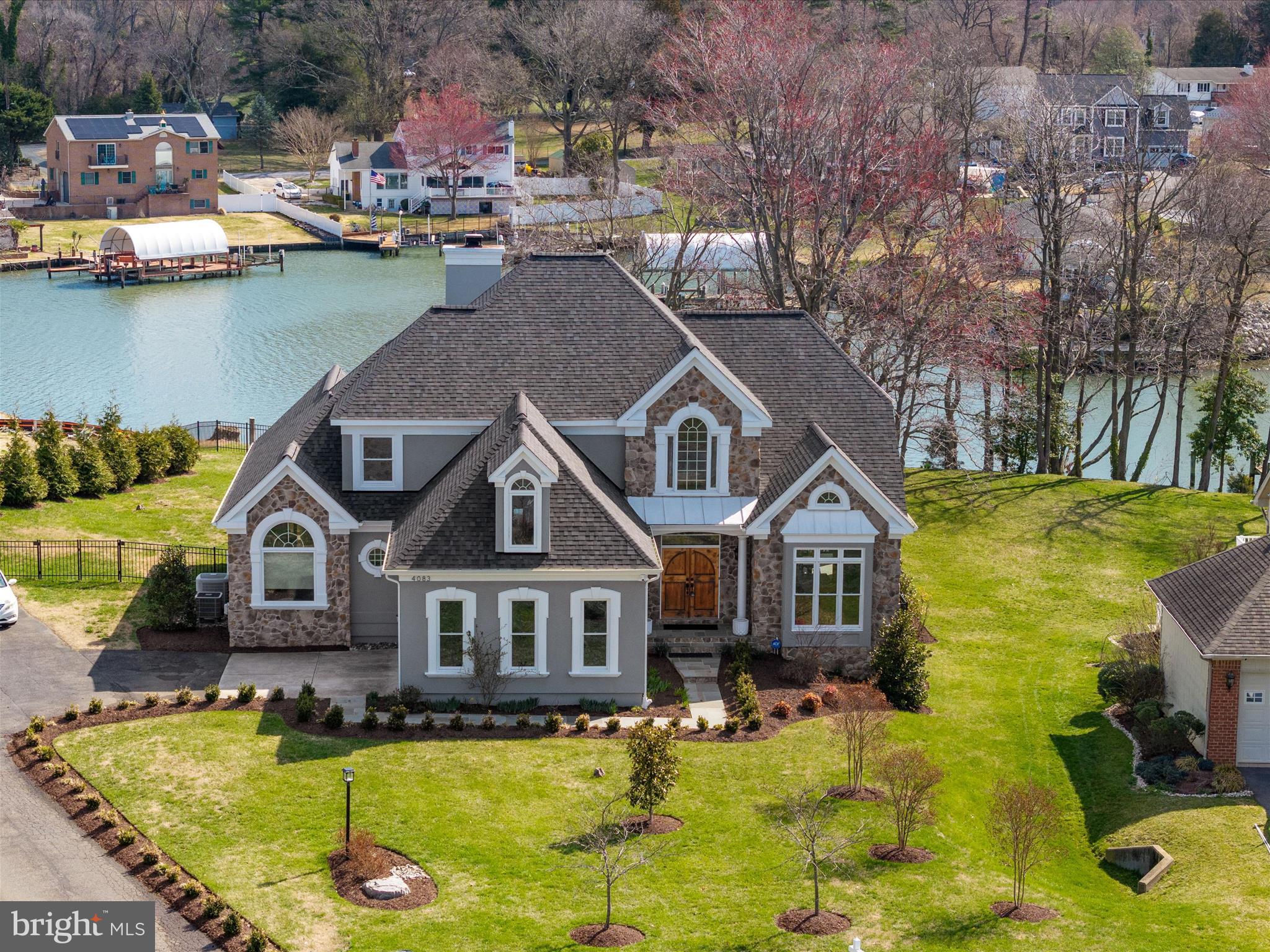 Welcome to Your Everyday Escape! Imagine waking up each morning to shimmering water views, sipping your coffee as the sun rises over the South River. This stunning waterfront retreat in the highly sought-after West Shore community offers more than just a home—it offers an entirely new way of living.
Set on over half an acre with 70+ feet of private water frontage, this residence blends luxury, comfort, and the beauty of nature into one unforgettable experience. With over 4,700 square feet of thoughtfully designed living space, there’s room to relax, entertain, and create lasting memories—whether you're hosting friends by your fire pit under the stars, hopping on the boat for a sunset cruise, or enjoying a quiet evening watching multi-color flames in your gorgeous stone fireplace..
Step inside to discover a completely renovated kitchen, where crisp cabinetry, endless storage, a massive island, and top-of-the-line appliances invite culinary creativity. The heart of the home flows effortlessly into spacious living and dining areas—each room designed to maximize the breathtaking views beyond.
The first-floor primary suite is a true sanctuary, featuring a cozy fireplace, a spa-like bathroom with luxurious finishes, a walk-in closet that dreams are made of and amazing water views. The finished walk-out basement offers even more space to stretch out, with easy access to the meticulously hardscaped outdoor living areas that call for gatherings all year long.
Peace of mind comes standard with a new roof (architectural shingles), new hot water heater, well tank, and  water conditioning system—so you can focus on enjoying your water oriented lifestyle.
Located just minutes from shopping, dining, and the beloved Black Market Bakery—not to mention top-rated Blue Ribbon schools—this home effortlessly combines the serenity of a waterfront getaway with the convenience of daily life. This isn’t just a home—it’s your vacation, every single day.