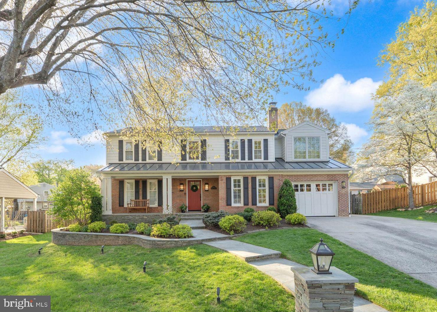 Welcome to 1854 Abbotsford Drive, a stunning residence in the heart of Vienna, Virginia — a home far more spacious than its charming curb appeal suggests. From the moment you arrive, two elegant stone pillars frame the sidewalk entry, and a welcoming front porch sets the tone for the warmth within.
Step inside to a gracious foyer flanked by a formal living room to the left and an adjoining dining room that opens beautifully to the entry. A versatile bonus room with fireplace on the main level is equally suited as a private office or additional sitting room. Just off the foyer, a stunning wet bar with wine fridge awaits the entertainer. The heart of this home is a show-stopping family room addition with gas fireplace— generously proportioned and perfectly positioned just off the chef's kitchen. Whether hosting holiday gatherings or casual evenings, this open-concept space flows effortlessly from inside to out: step through to a magnificent stone patio with fire pit and, to the right, a charming screened-in porch with natural gas grilling— an ideal retreat in any season.

The beautiful hardwood floors on the main and upper levels create a warm, cozy vibe throughout the house.  Upstairs, five bedrooms and three full baths offer space for everyone. The luxurious primary suite is a true sanctuary, appointed with a spa-inspired glass shower and a deep soaking tub.  Upstairs, five bedrooms and three full baths offer space for everyone. The upper-level laundry room gives this modern convenience a luxurious feel.  The lower level is a cozy, carpeted haven — quiet and comfortable, perfect as a media room, recreation space, or guest retreat.  The lower level front projection home theater system with 92-inch surround system (plus subwoofer) adds to the perfect entertaining features this home offers.  A full bath also serves the lower level, and a spectacular redwood temperature-controlled wine storage room with glass doors completes this level. The large storage room flanking the lower-level living area is so convenient for all extra personal items and holiday decorations.  

One-car garage plus an oversized parking pad accommodating three additional vehicles. The fully fenced, flat backyard is lushly landscaped and ready for play and relaxation alike. This is Vienna living at its absolute finest — don't miss it.