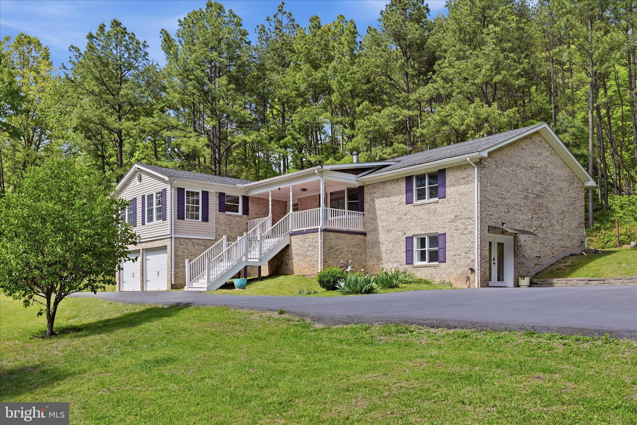 It's amazing!! Priced to sell quickly for this beautifully remodeled all-brick rambler offering 5 bedrooms, 3 full baths, and 3,896 square feet of living space. Situated on 5.6 acres bordering Shenandoah National Park, this exceptional property offers a rare combination of luxury, privacy, and natural beauty.

This home is filled with impressive features, including a newly built, expanded circular asphalt driveway, a spacious storage room connected to the 2-car garage, spacious living areas, modern updated finishes, and breathtaking views right from your doorstep. Step outside and enjoy your own backyard retreat with a stone patio, pavilion, and beautifully landscaped garden.

Whether you are seeking peace and tranquility or outdoor adventure, this property offers the perfect setting. The ground-level apartment provides an excellent opportunity for an in-law suite or an Airbnb rental for hikers and travelers. It features a separate entrance, full kitchen, and laundry room for added convenience and flexibility.

A detailed remodeling sheet is available in the documents section for your reference and highlights the extensive improvements made to this remarkable home.

Come experience the beauty, value, and endless possibilities this exceptional property has to offer.