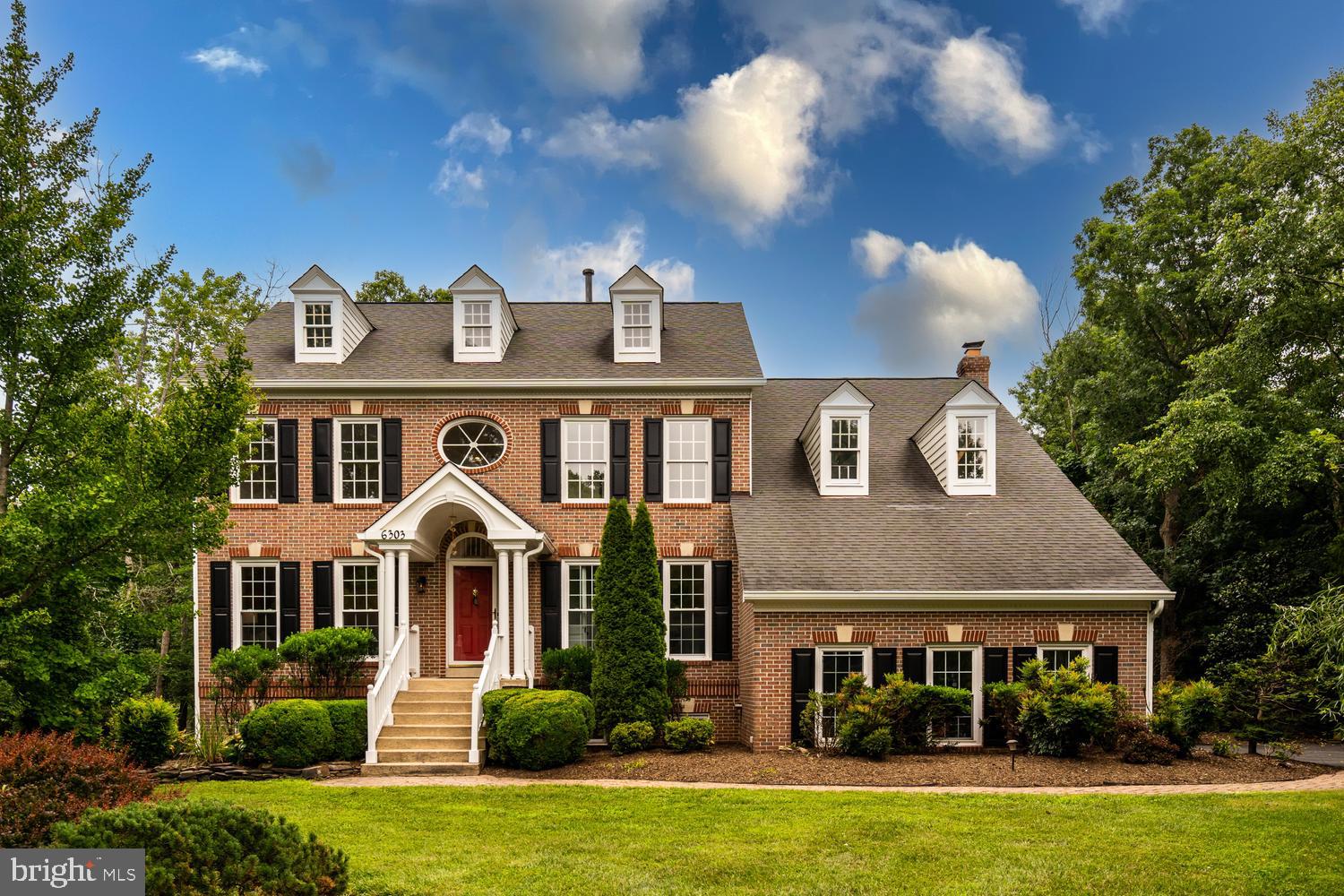 Welcome to 6303 Pebblebrook Terrace, a beautifully refreshed Colonial tucked away on a quiet cul-de-sac in the desirable Pleasant Forest community of Centreville. Thoughtfully updated inside and out, this elegant residence offers timeless curb appeal, generous living spaces, a 2-car garage, and a floor plan designed for both everyday comfort and refined entertaining.

A dramatic 2-story foyer sets the tone with classic hand-painted mural details, adding a distinctive sense of character, elegance, and sophistication. The main level features formal living and dining rooms, an inviting large family room, and a private study or home office with glass doors is ideal for today’s flexible lifestyle. The updated kitchen offers a clean, sophisticated, and modern feel with two-tone cabinetry, granite countertops, stainless steel appliances, a new dishwasher, and a new French-door refrigerator with double freezer drawers.

Upstairs, the spacious primary suite serves as a private retreat with high ceilings, two walk-in closets, a large sitting room, and an en-suite bath featuring a separate soaking tub, separate shower, and double-sink vanity. Three additional bedrooms and a full bathroom complete the upper level.

The lower level expands the home’s flexibility with two versatile bonus rooms, a full bathroom, and a spacious living area with two doors leading to the backyard. This level is ideal for guests, recreation, fitness, hobbies, a second work-from-home setup, or additional everyday living space.

Outdoor living is equally inviting with a brand-new deck overlooking the fenced backyard—perfect for entertaining, relaxing, pets, play, and enjoying the serene natural backdrop. Recent enhancements include fresh interior and exterior paint, new carpet, updated lighting and fixtures, an updated lower-level bathroom, beautiful landscaping, and more.

Ideally located in the Pleasant Forest community, this home offers easy access to major commuter routes including I-66, Route 29, Route 28, Braddock Road, and Fairfax County Parkway. Commuters will appreciate nearby Fairfax Connector service, Centreville Park & Ride options, and convenient access to the Vienna Metro station. The location is also approximately 30 minutes from Dulles International Airport and approximately 40 minutes from Reagan National Airport, depending on traffic, offering exceptional regional and international travel convenience.

With its cul-de-sac setting, classic Colonial architecture, thoughtful updates, fenced outdoor space, commuter-friendly location, and excellent Centreville convenience, this home offers the perfect blend of elegance, comfort, and everyday functionality.