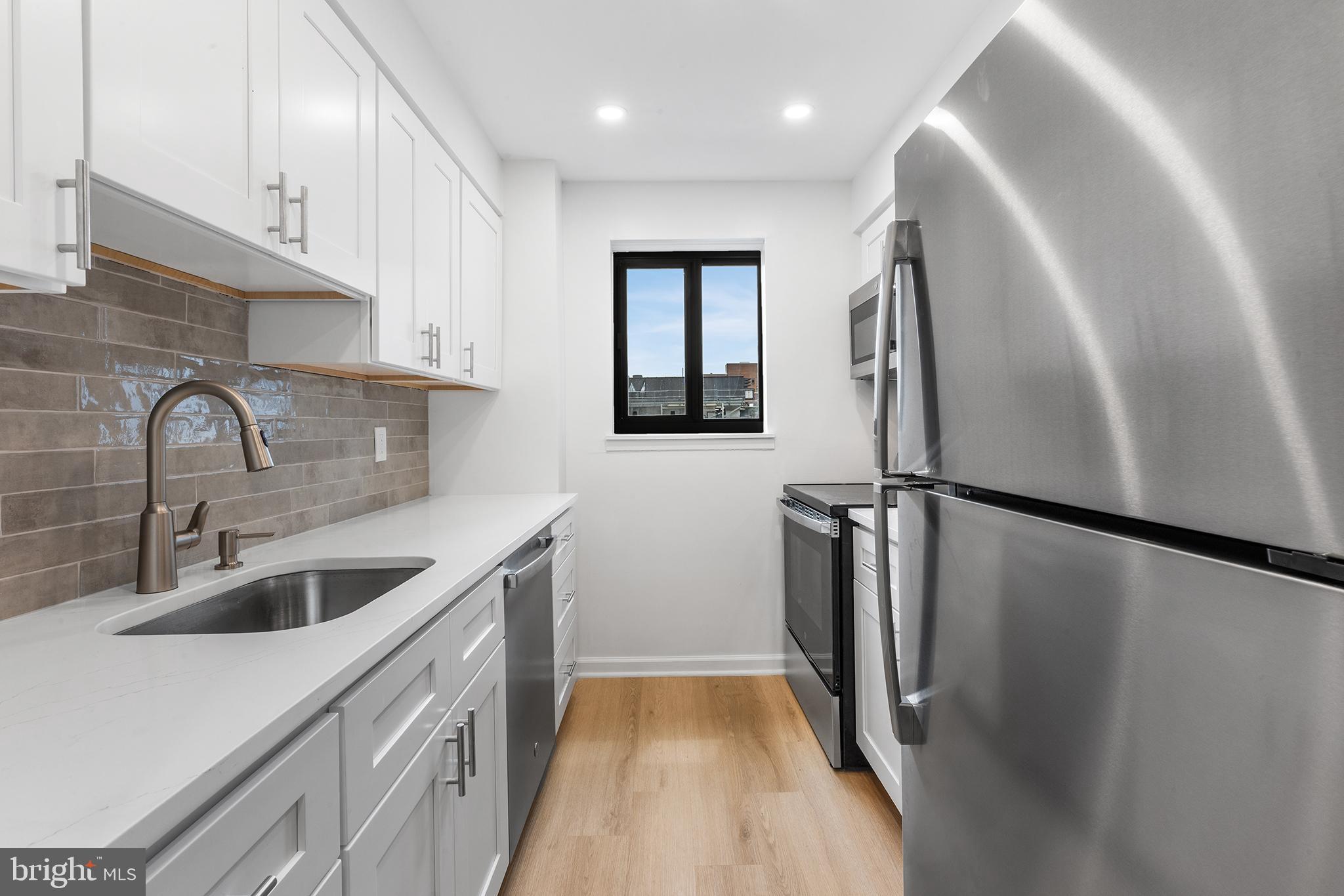 Welcome to Academy House, where modern updates, exceptional amenities, and an unbeatable Center City location come together to create an outstanding urban living experience. This beautifully RENOVATED ONE-BEDROOM, ONE-BATH residence offers a thoughtfully designed layout with generous living spaces, stylish finishes, and abundant natural light throughout. Upon entering, you are greeted by a spacious OPEN-CONCEPT living and dining area that provides the perfect setting for both everyday living and entertaining. LARGE WINDOWS and a sliding glass door fill the home with sunshine throughout the day while offering CAPTIVATING CITY VIEWS that become especially striking in the evening. Step outside onto your PRIVATE BALCONY and enjoy your morning coffee, unwind after work, or simply take in the vibrant skyline. The updated galley kitchen is both functional and attractive, featuring STAINLESS STEEL APPLIANCES, granite countertops, ample cabinetry, and a window that brings in additional natural light. The generously sized bedroom offers a comfortable retreat with plenty of space for furnishings and storage, while the renovated bathroom is well-appointed with modern finishes. For added convenience, the unit also includes an IN-HOME WASHER AND DRYER. Life at Academy House extends far beyond your front door. Residents enjoy an impressive collection of amenities designed to support wellness, relaxation, and convenience. A 24-HOUR FRONT DESK, and a state-of-the-art FITNESS CENTER that features two unique ENDLESS SWIM-IN-PLACE POOLS, A HOT TUB, AN AEROBICS AREA, and a wide range of exercise equipment. The beautifully maintained shared TERRACE level serves as an extension of your living space, offering inviting indoor and outdoor areas perfect for reading, socializing, working remotely, or simply enjoying a peaceful moment away from the bustle of the city. The location is second to none. SITUATED IN THE HEART OF CENTER CITY, Academy House places Philadelphia’s finest dining, shopping, entertainment, and cultural attractions just steps from your door. Enjoy easy access to renowned restaurants, world-class performance venues, and the green open spaces of Rittenhouse Square. Commuters will appreciate exceptional transportation options, including convenient access to SEPTA bus and subway lines, PATCO, and Amtrak services. NEARBY UNIVERSITIES such as Drexel University, the University of Pennsylvania, and Thomas Jefferson University further enhance the appeal. This exceptional residence offers the perfect combination of comfort, convenience, luxury amenities, and a prime Philadelphia location—an ideal place to call home.
