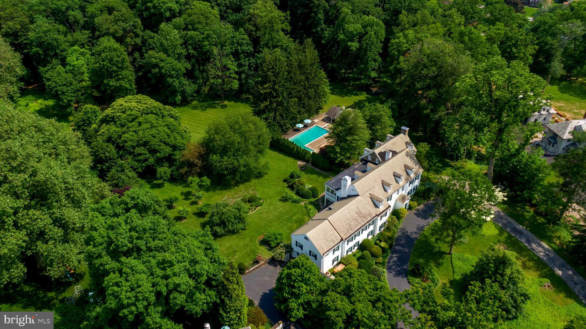 Welcome to this 3.73-Acre Sanctuary in the Heart of the Main Line In an era where the Great Estates of Lower Merion are being subdivided and condensed, Hearthstone stands as a defiant outlier. Spanning nearly four lush, level acres in the coveted Indian Creek corridor, this is not just a residence—it is a private ecosystem. It offers a scale of "Land and Liberty" that is virtually extinct in Wynnewood, providing the next steward with a canvas of almost 4 acres to create a generational masterpiece.

Commissioned in 1928 by William P. Simpson, President of the Eddystone Manufacturing Company, the estate was born of a singular vision. Simpson personally designed the home to anchor a life of industrial-age grandeur. Known historically as "Hearthstone," the residence served as a beacon of the 1930s social circuit, positioned steps from the Indian Creek Nature Preserve.

Today, the house retains its original 13,000+ square feet of grand-scale architecture. With its stone façade, two-level elevator, and soaring enclosed porches overlooking the gardens, the bones of the estate offer a structural integrity and "volume" that modern construction cannot replicate.

This home is truly a Lifestyle Without Compromise:  While most luxury homes in the district offer proximity or privacy, Hearthstone provides both.   The Main Residence: 9,800+ SF of finished living space, with an additional 3500+ SF unfinished, featuring 10 bedrooms and grand entertaining halls awaiting a high-design transformation.  The Orchard & Grounds comprise of a flat, oversized yard—rare for the topography of the area—complete with a private fruit orchard and specimen gardens.

The Aquatic Pavilion is a classic 10-foot deep in-ground pool anchored by an oversized patio and a dedicated Bathhouse with room for improving the full amenities such as the individual shower facilities and wet bar designed for grand-scale summer galas and garden weddings.

The Infrastructure is already equipped with a full-house generator and 5-zoned HVAC, the estate offers a sophisticated head-start on a modern restoration.

Hearthstone offers a strategic advantage for the modern family. Situated in the heart of the award-winning Lower Merion School District, it sits at the epicenter of the nation’s most elite private academies, including Baldwin, Haverford, Shipley, and Agnes Irwin. With the Merion Cricket Club and world-class golf just minutes away, the estate offers a seamless blend of secluded sanctuary and social connectivity.

This is not Ia finished product; rather it is an opportunity to be the next great steward of a Wynnewood landmark, minutes to the city in an award-winning school district. For the buyer who understands that land is the ultimate luxury, Hearthstone represents a "buy-and-renovate" scenario where the finished value will be personalized to what future buyers want in a luxury home as well as command the top of the Main Line market.  Hearthstone is more than a home; it is a 3.73-acre legacy!