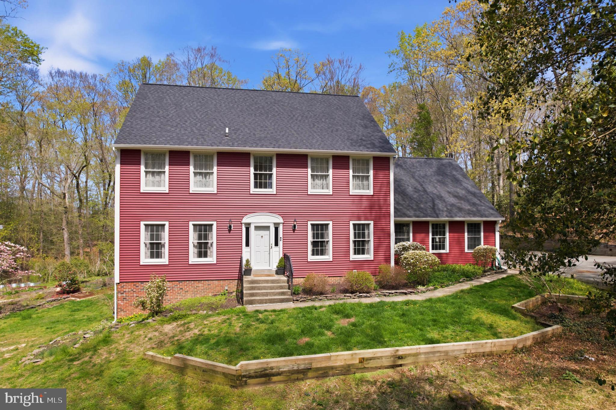 Welcome to this unique 5 bedroom, 3.5 bath Colonial home in Ferry Landing Woods Community.
Over 3 acres of peaceful grounds with a natural masterpiece backyard featuring a picturesque pond with colorful koi fish. 
Entertain in style within the spacious dining room, ideal for hosting intimate meals or grand gatherings. The living room, a gorgeous gathering space, features soaring high ceilings with skylights and uniquely shaped windows that brighten the room and beautifully balance it with a cozy rustic feeling.  At the heart of the home, you'll find a huge chef-level kitchen, perfectly designed for a large scale, seamless cooking and  entertaining. It features a professional-grade gas range with an integrated hibachi griddle plate and a sleek built-in refrigerator for a truly seamless design. This home features a convenient main-level office, perfect for remote work.
The upper level has 4 bedroom with the primary suite designed for ultimate relaxation with newly renovated en-suite bath, features a deep soaking tub and an updated shower, build-in dressing room, and a private deck to enjoy quiet mornings. In additional full bathroom serves the other bedrooms.
The finished basement adds incredible value with a spacious game room with full bar, a dedicated workshop, and additional bedroom provides the perfect guest suite.
The property has been meticulously upgraded including a new septic in 2023, new HVAC in 2024, partial new roof and siding in 2025, new update appliances of washer, dryer, and dishwasher. New well pump and water softener. New front/storm door. Freshly painted throughout, and unified two-key doorknob system. Welcome Home.
Perfectly located for privacy yet easy access to DC and Baltimore via I-95 and Rt. 295.