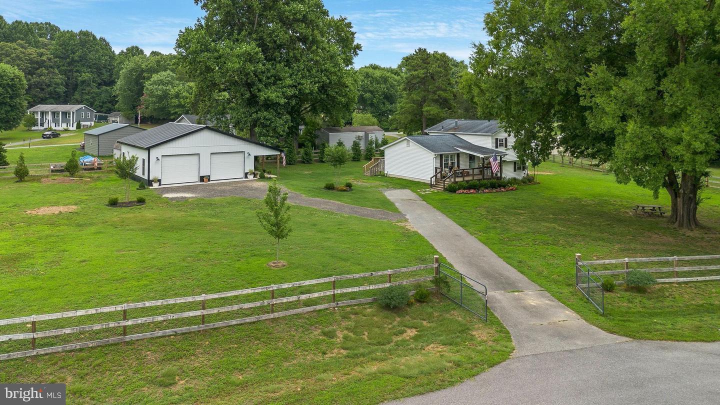 Open House April 19 at 11am to 2pm, no showings before the Open House.  Professional Photos by April 12. Charming  renovated split-level home on 1 acre including a spacious 30'x32' two-car detached garage, complete with a covered side porch. This well-kept home features 3 bedrooms, 2 full baths, a dining area off the kitchen, a living room, and a cozy family room with a fireplace on the lower level. The kitchen has gorgeous granite countertops with updated cabinets and stainless steel appliances. The 3 generously sized bedrooms on the upper level share a renovated full bath. The lower level offers a recreation room with a fireplace, a  laundry room, and a second full bath. The pellet stove will economically heat the entire home and features a touch screen for easy programming. Both the covered front porch and back deck have been recently replaced.  Additional features include all new windows and doors, a fully fenced yard, an in-ground irrigation system, a conditioned crawl space, and a security system. You'll also find a large shed in the backyard for storing lawn equipment, and the ventilation system has been professionally cleaned. The home is also conveniently located, close to shopping and schools.