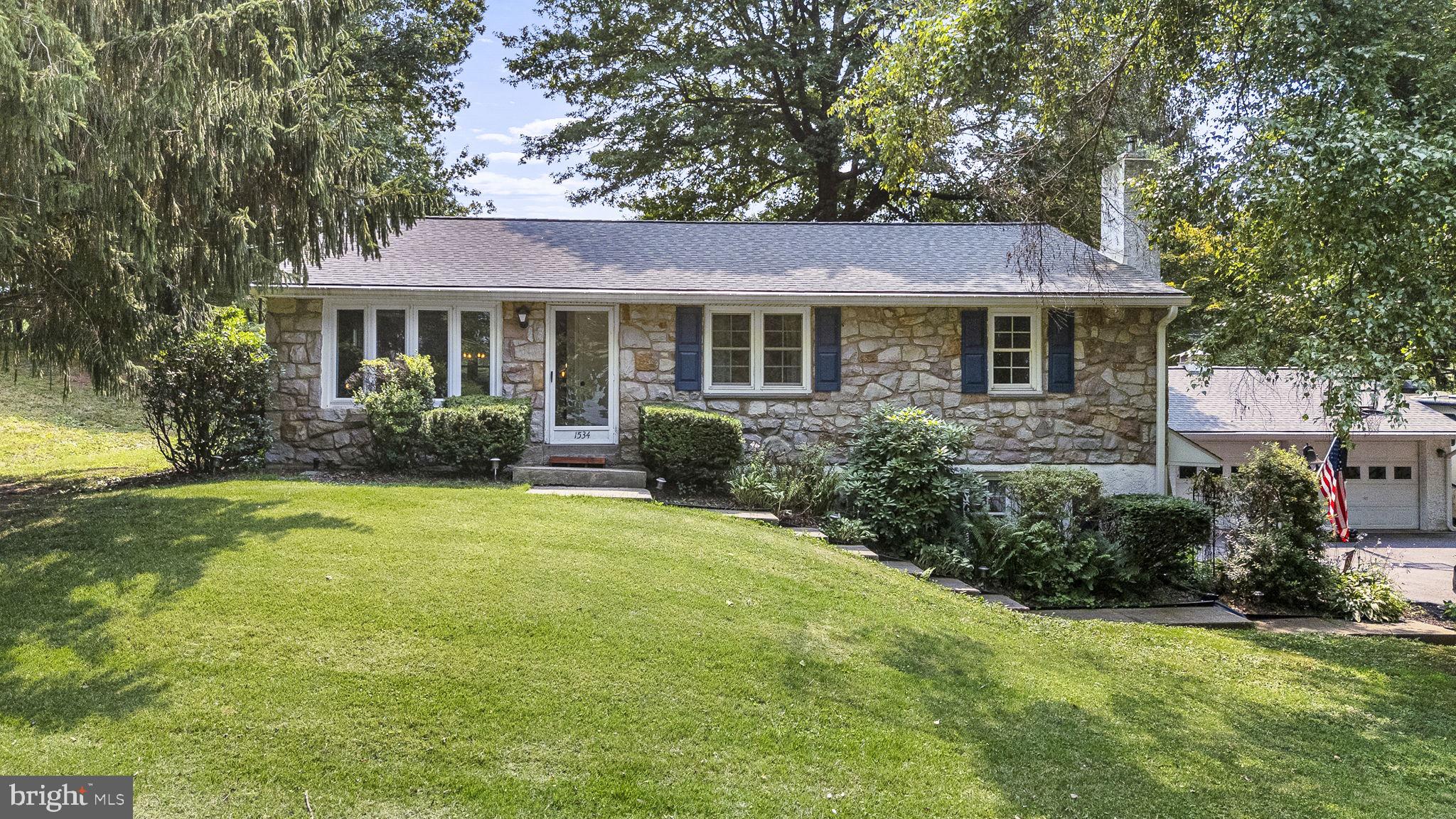 Welcome to 1534 S Keim Street, where comfortable one-floor living, exceptional storage, outdoor recreation, and thoughtfully completed major improvements come together in the highly desired Owen J. Roberts School District. Set along a quiet road with convenient access to Routes 422 and 100, this three-bedroom, two-bath ranch offers the confidence of a newer roof installed in 2022, a new electrical panel and HVAC system completed in 2023, replacement windows, and a hard-wired whole-house generator.

Inside, original hardwood floors add warmth and character throughout the main level. The bright living room features a new bay window installed in 2023, while the kitchen and primary bathroom were renovated in 2019. A floored, walk-up attic provides abundant and easily accessible storage, and an attic/whole-house fan offers another option for circulating fresh air throughout the home.

The finished lower level significantly expands the home’s living space and walks directly out to the driveway. The comfortable lower-level den features a pellet stove insert set within a striking stone fireplace, providing an efficient supplemental heat source capable of warming the entire home. An additional bonus room offers flexibility as a home office, playroom, exercise area, craft room, hobby space, or additional storage.

Outdoor living is equally impressive. Relax on the screened-in porch or step outside to the patio where you can continue up to the fenced in-ground swimming pool. A dedicated pool house provides plenty of space for equipment, toys, and seasonal storage. It is also equipped with flood-lighting bright enough to illuminate the entire swimming area for night swimming. App and timer-controlled path lights add ambiance and functionality while enhancing the property’s evening appeal.

Vehicle, recreational, and workshop enthusiasts will appreciate the attached two-car garage with electric openers and two interior access points, along with the oversized detached two-car garage equipped with electricity and electric garage door openers. A carport can easily be added alongside the detached garage over the 30-amp electrical hookup which provides the ideal setup for an RV, camper, additional vehicle, or recreational equipment.

With three oversized enclosed garage spaces, extensive storage, flexible finished living areas, a private pool setting, and many of the home’s major-ticket improvements already completed, this property offers a rare combination of comfort, convenience, recreation, peace, and long-term value—just minutes from shopping, dining, and major commuting routes.