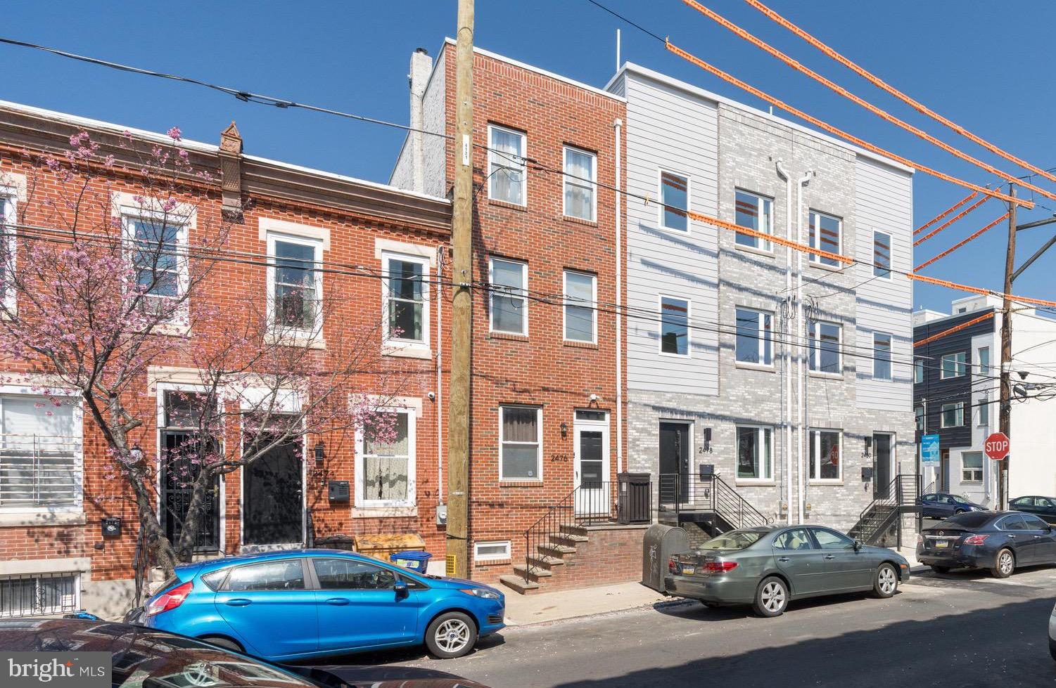 Welcome to this stunning new construction home in the heart of East Kensington, one of Philadelphia’s most vibrant and rapidly growing neighborhoods. Built by a well-known local developer, this thoughtfully designed 3-story home with a finished basement offers modern finishes, flexible living space, and a 10-year tax abatement plus a 1-year builder warranty.

Step inside to an open and inviting main level featuring hardwood flooring throughout, a spacious living room, dining area, and a beautifully designed kitchen. The kitchen showcases quartz countertops, stainless steel appliances, stylish backsplash, and modern cabinetry, making it perfect for both everyday living and entertaining. Just off the kitchen is a nice-sized private backyard, ideal for relaxing, gardening, or hosting gatherings.

The finished basement adds valuable living space and includes a bedroom, full bathroom, and flexible area that could be used as a home office, gym, media room, or guest space.

On the second floor, you’ll find a convenient washer and dryer closet, two generously sized bedrooms, and a full hall bathroom.

The third floor is dedicated to the owner’s suite, offering privacy and comfort with a spacious bedroom, three closets, and a luxurious full bathroom featuring a walk-in shower. This level also includes an additional bedroom that can easily serve as an office, nursery, or flex space

Top it all off with a full roof deck, providing the perfect spot to enjoy city views, relax, or entertain guests.

Located in red-hot East Kensington (19125), this home offers close proximity to restaurants, cafes, shopping, and public transportation, making it an ideal blend of modern living and urban convenience.