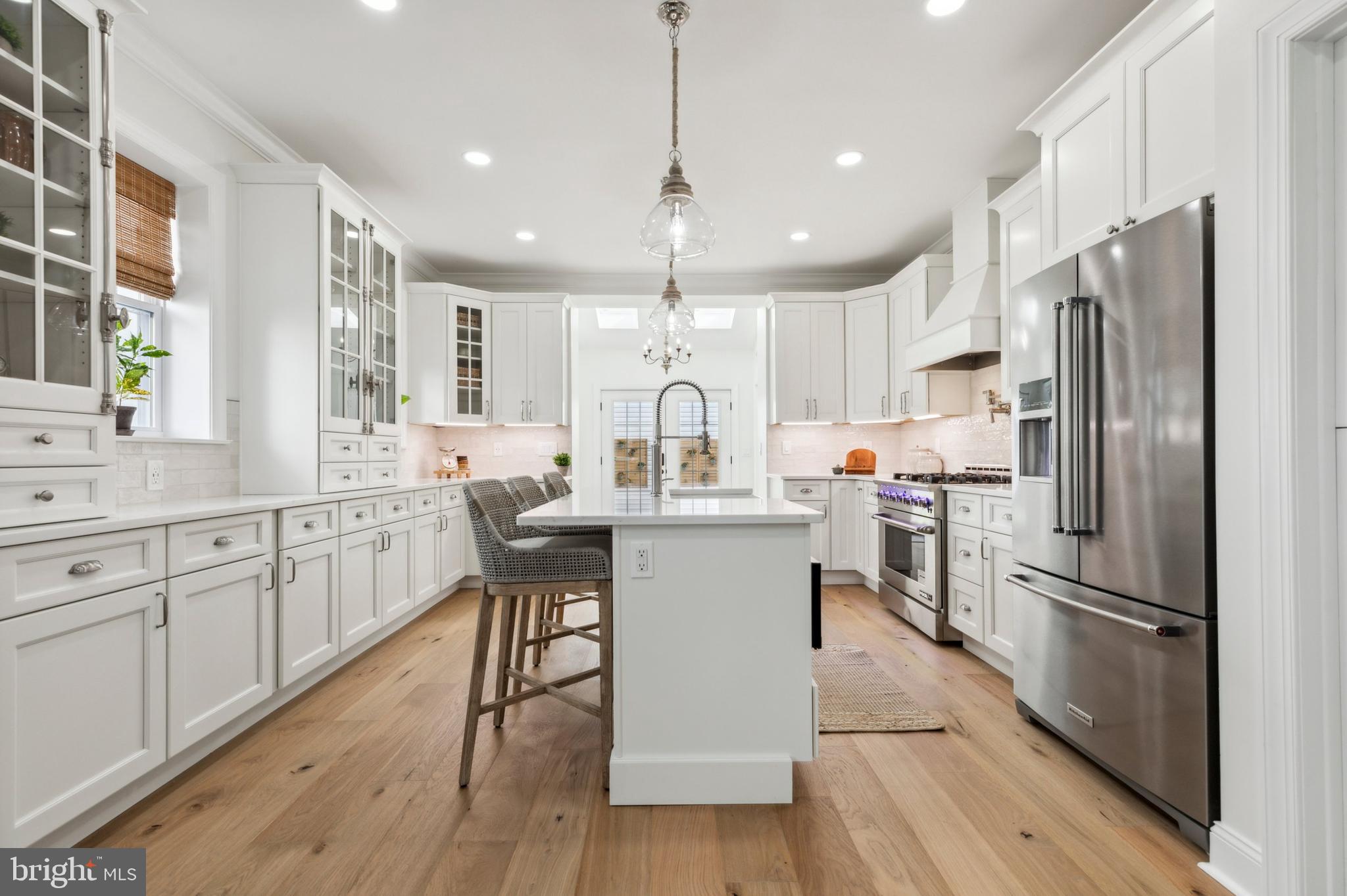 Welcome Spring Time! No Stone Left Unturned in This Transformed Single Family Residence!  This luxurious 4 bedrooms, 3 full bathrooms, 1 half bathroom stand-alone home, includes 4125 square feet of total of living space with 9+ off-street parking spaces, just minutes from Main Street Manayunk, offers unparalleled craftsmanship and exceptional amenities.  Landscaping, fresh exterior paint, improved smart security features and entry locks, and addition of CertainTeed siding are amongst some of the curb appeal upgrades.  Upon entering the home, you are greeted by French oak hardwood floors, crown molding, and a bright, open floor plan that seamlessly connects the living room to the dining room leading through to the kitchen.  The family room boasts a gas fireplace with marble, craftsman style surround that provides the perfect balance of casual comfort and elegance.  Meticulous attention to detail is presented in this timeless, French-inspired kitchen which showcases new Calacatta Miraggio quartz countertops, custom Fabuwood cabinetry, Zellige subway tile backsplash, brand-name stainless steel appliances, Kohler plumbing fixtures and a large center island with farmhouse sink.  A Dutch door off the kitchen leads to a finished basement with Mohawk carpet, plenty of storage space, and modernized full bathroom.  Adjacent to the kitchen, a skylit vaulted ceiling foyer showers its mirroring spaces, a powder room and laundry room, with an abundance of natural light.  The laundry room is fit out with Samsung washer and dryer, butcher block countertop, and a ceiling mounted hang drying pulley system.  A spacious master bedroom suite with walk-in closet lies at the forefront of the second floor.  The ensuite bath is equipped with a Roman-style shower with frameless glass surround, rainfall showerhead, Kohler fixtures, and polished marble tile.  Another full bathroom, complete with a modern Fibo shower surround, and bedroom complete this level.  Upstairs you’ll find two other bedrooms and an ample sized storage closet.  Rear French doors open to a private fenced in backyard and patio provides plentiful space for gardening and entertaining.  At the rear of the paved driveway is a 1400 sq ft insulated and partially-heated two-story bonus structure with elevated 16’x16’ deck and half bathroom which has the capacity to be an in-law/guest suite, storage space, office or much more!  Additional improvements to the home include upgraded low-E energy efficient windows, WiFi enabled 5-zone remote-controlled mini-split heating/cooling system, recessed LED lighting throughout and fresh interior/exterior paint. Property owned by a licensed general contractor.  The home is centrally located in walking distance to all the conveniences and restaurants near Ridge Avenue and on Main Street, as well the train station and local park.     
    "Come See This Hidden Gem In Roxborough Manayunk"!
