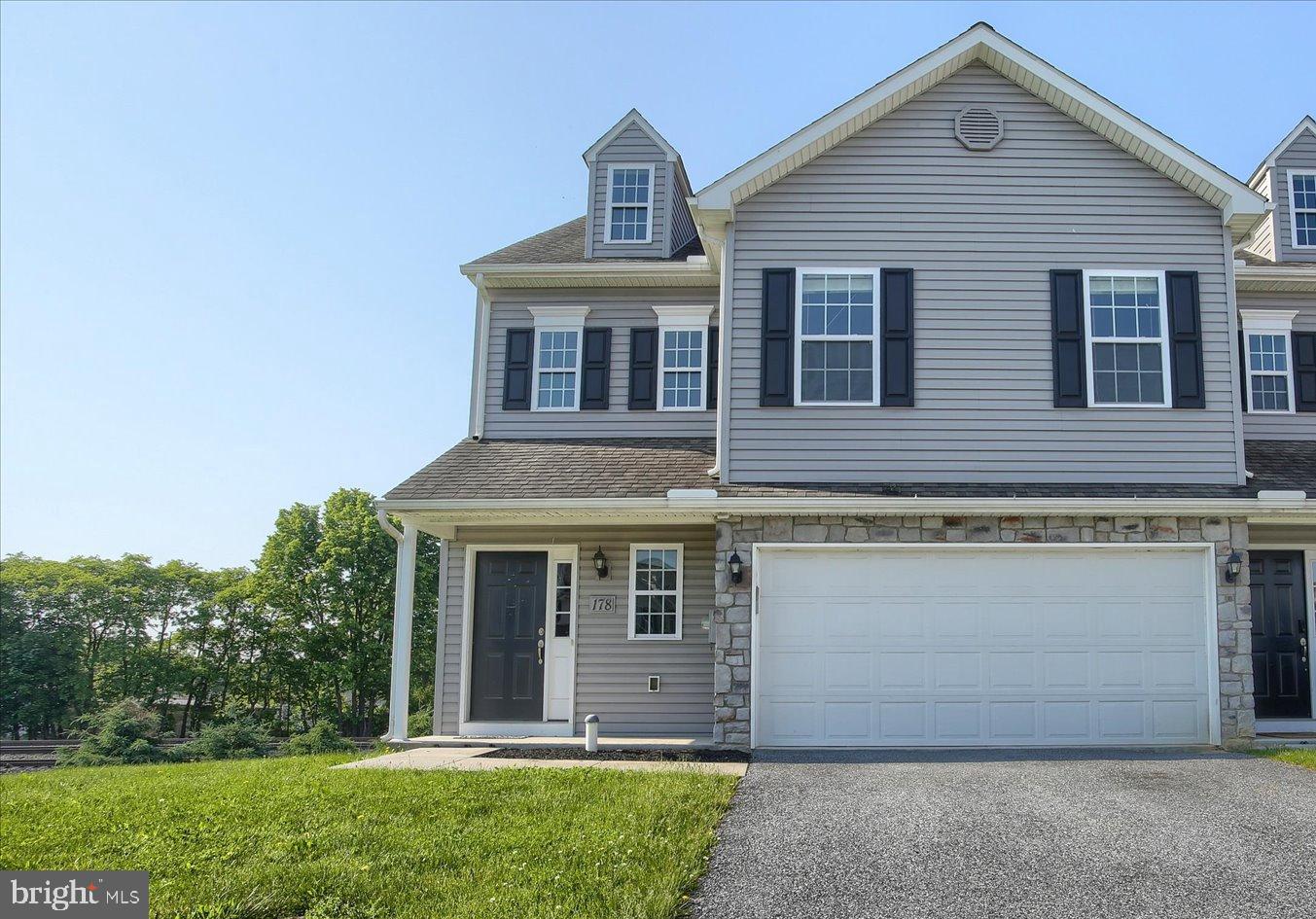 Beautiful end-unit townhome featuring 3 bedrooms and 2.5 baths, 2nd floor laundry, new paint throughout and new carpet on the main level. The spacious layout includes a bright living area, a modern kitchen with breakfast bar, and a partially finished walkout basement perfect for a family room, home office, gym, or entertainment space. The primary suite includes a private bath, large walk-in closet, shiplap accent wall and a beautiful barn door while two additional bedrooms provide plenty of room for family or guests. Conveniently located near shopping, dining, and major commuter routes. Move-in ready and full of potential — don’t miss this opportunity!