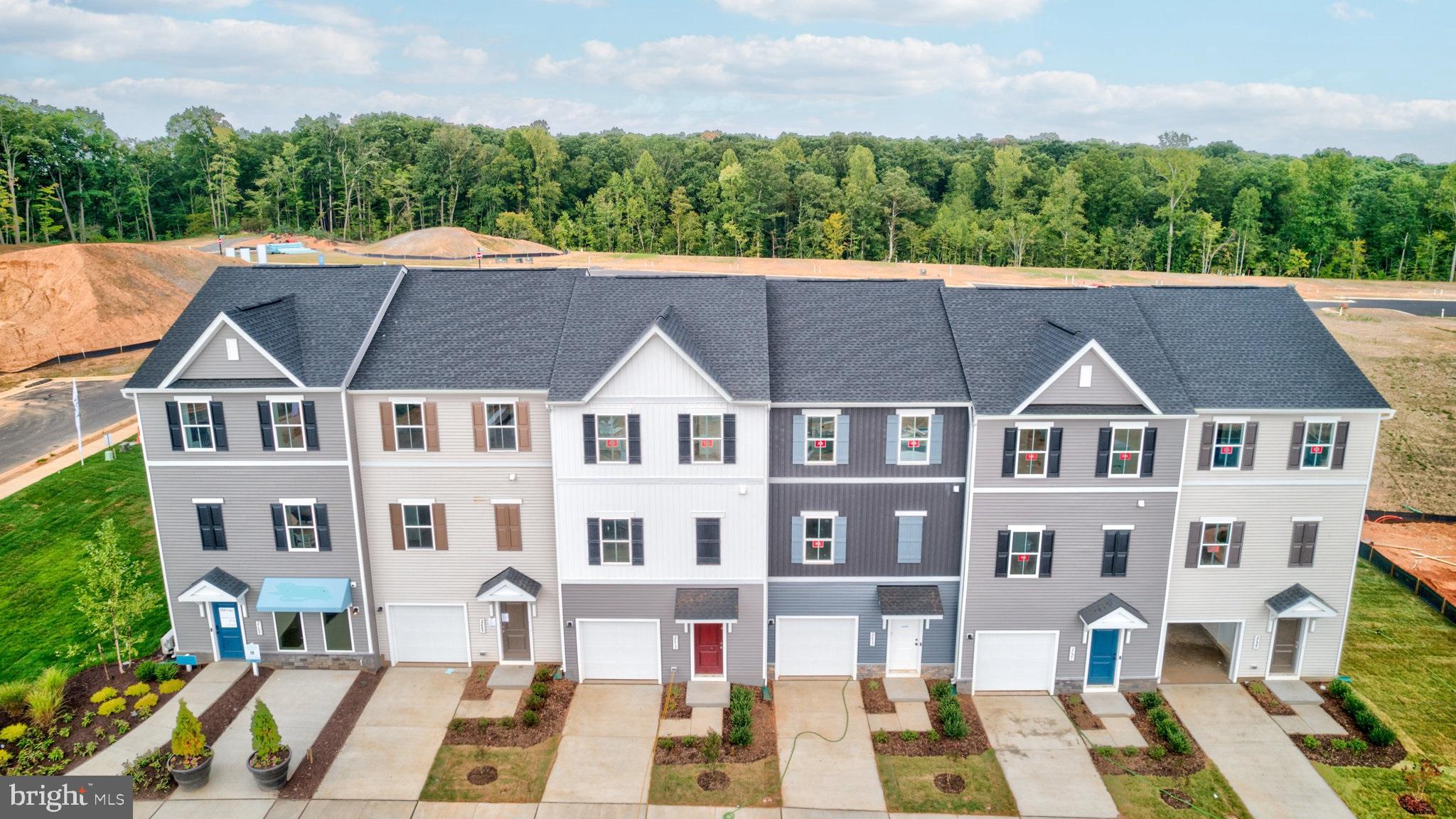 MOVE IN THIS SUMMER****A lovely neighborhood of townhomes located  in the Wilderness Shores community near the Rapidan River; and ideally located between Culpepper and Fredericksburg, VA -- close to shopping, recreation and commuter routes.  Enjoy the community amenities with clubhouse, outdoor pool, playground, walking trails and biking trails.  This home features a built-in 1-car garage and activity room with attached full bath on the main level.  First upper level includes a spacious kitchen with island and pantry, stainless steel appliances; plus a great room with deck, and dining area with a powder room.  Upper level 2 includes three  bedrooms,  two full baths and laundry.  The Primary bedroom has a full bath and large walk-in closet and attached bath with walk-in shower.  Prices and terms subject to change. PHOTOS/RENDERINGS ARE REPRESENTATIVE ONLY AND MAY SHOW UPGRADES OR DESIGN ENHANCEMENTS.