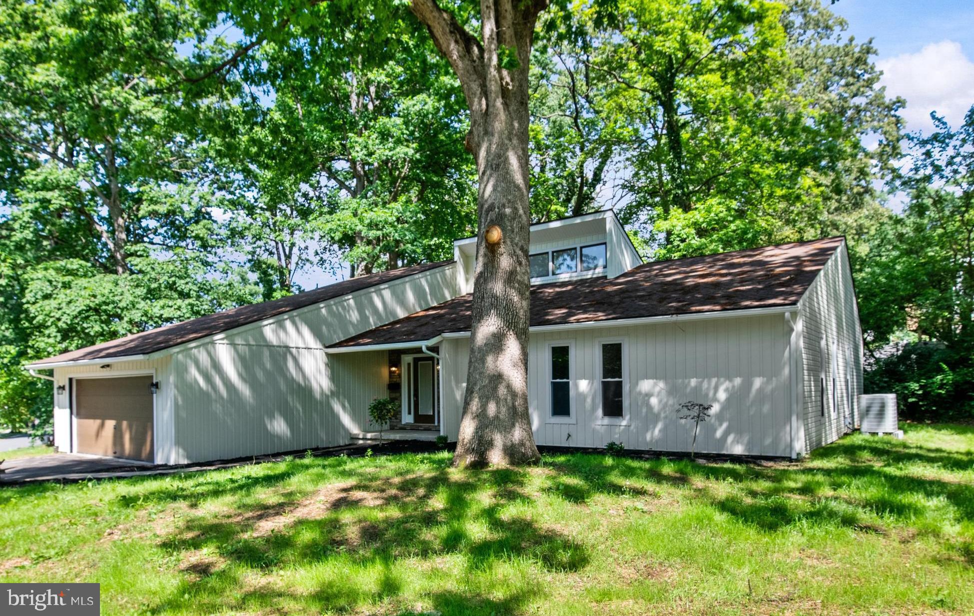 This Stunning Contemporary offers One Floor living with amazing Vaulted ceilings and New windows throughout. Renovated top to bottom, and outside, the new owner will enjoy a Gorgeous Custom Kitchen with Taj Mahal Quartzite Tops and Backsplash, Upgraded Stainless appliances Double Ovens and classy new lighting. The Vaulted Breakfast area & Family Room with Fireplace are open to the New Kitchen! The huge Great Room, also Vaulted, boasts Huge Windows & Sliders to the Sunroom & Deck beyond. Three nice size bedrooms share an updated hall bath. The Primary Bedroom features a Walk-in Closet and Luxury Bath with Slipper Tub & beautiful Custom Tile shower. The Laundry and Half-Bath sit between the Kitchen & Garage and the Freshly Painted Basement is home to Great Mechanicals and is ready to be a Future Rec Room. Available for Quick Closing!