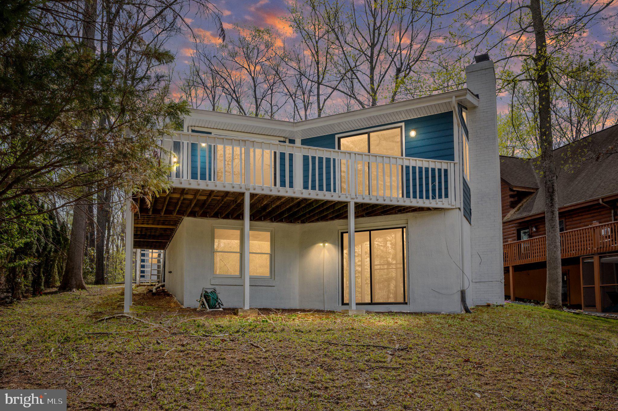 Fully renovated in 2026 and priced below its recent appraised value, this exceptional waterfront retreat offers a rare opportunity for immediate equity in the coveted Lake of the Woods community. Boasting 75 feet of private waterfront on Lake Keaton, this move-in-ready home delivers the perfect blend of luxury, flexibility, and lakefront living.

Offering 4 bedrooms, 3 full baths, and two versatile bonus rooms, the thoughtfully designed floor plan adapts effortlessly to today's lifestyle needs, whether you're seeking guest accommodations, a home office, fitness space, hobby room, or weekend retreat. Skylights flood the open-concept living areas with natural light, while two fireplaces create warmth and character throughout the home.

The beautifully updated kitchen features premium appliances, an electric range, abundant prep space, and a well-appointed pantry designed for both everyday living and entertaining. The spacious primary suite serves as a private sanctuary, complete with a spa-inspired en-suite bath and walk-in closet. A fully finished lower level provides even more flexible living space for family and guests.

Step outside to expansive waterfront decking overlooking peaceful lake views. Your private dock offers direct access to boating, fishing, kayaking, paddleboarding, and endless days on the water.

Located within the highly sought-after gated Lake of the Woods community, residents enjoy access to private beaches, pools, a marina, tennis courts, walking trails, a fitness center, dining, and year-round recreational amenities. Conveniently situated near Fredericksburg, shopping, dining, and major commuter routes, this home combines the serenity of waterfront living with everyday convenience.

With limited waterfront inventory available, private dock access, extensive renovations, and pricing below appraised value, this is an outstanding opportunity to secure a turnkey lakefront home while gaining instant equity from day one.