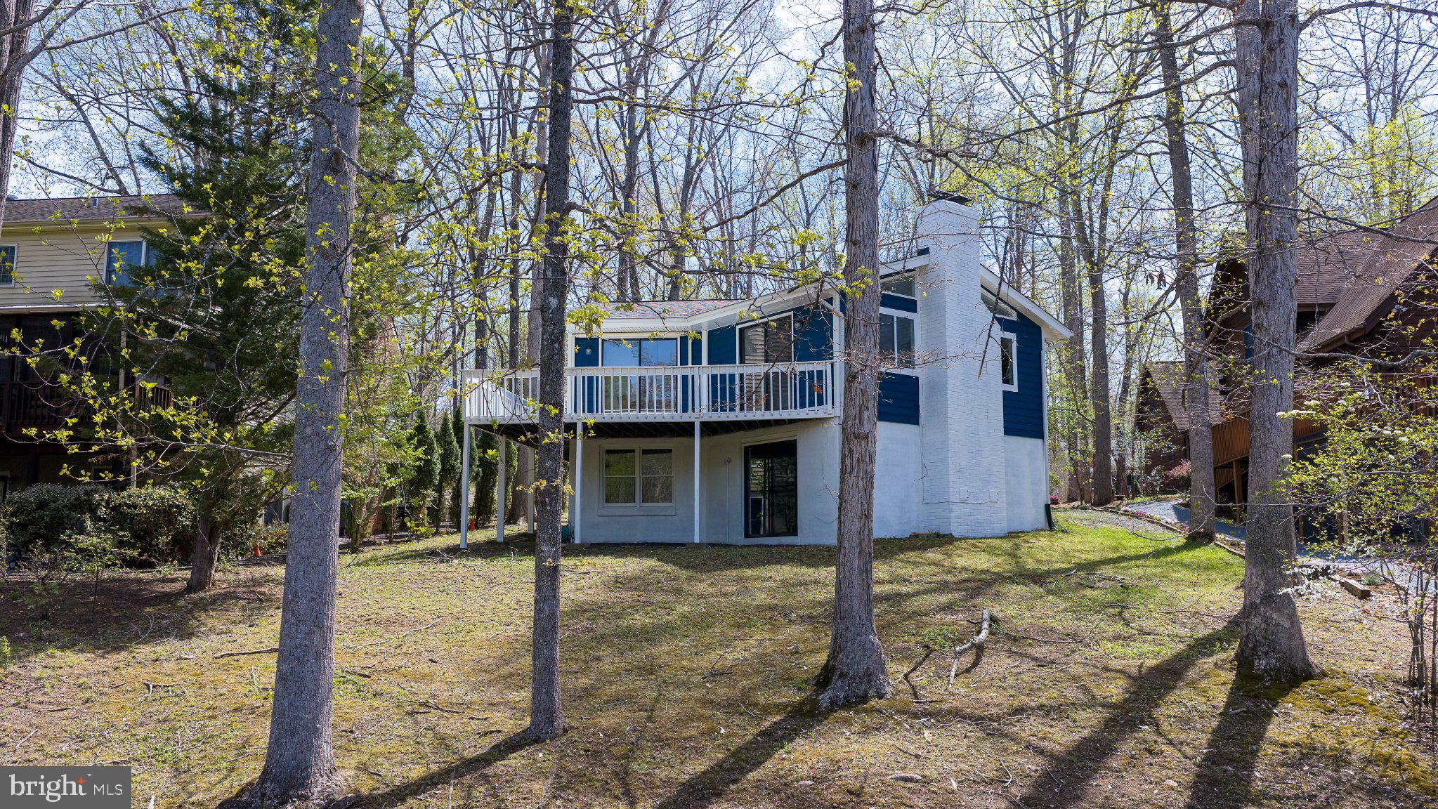 Fully renovated in 2026 and offering 75 feet of private waterfront on Lake Keaton, this turnkey waterfront retreat in the highly sought-after gated Lake of the Woods community delivers the lifestyle buyers are searching for. This exceptional 4-bedroom, 3-bath home with two versatile bonus rooms offers the flexibility today’s buyers need, whether for full-time living, weekend escapes, guest accommodations, home office space, fitness, or recreation. Natural light fills the open-concept layout through skylights, while two fireplaces add warmth and character to the thoughtfully designed living spaces. The beautifully updated kitchen features premium appliances, an electric range, generous prep space, and a well-designed pantry that blends function and style. The spacious primary suite serves as a private retreat with a spa-inspired en-suite bath and walk-in closet. The fully finished lower level adds even more valuable flexible living space. Step outside to an expansive waterfront deck designed for entertaining, relaxing, and enjoying peaceful lake views, with your private dock providing direct access for boating, fishing, kayaking, and waterfront recreation. Located within amenity-rich Lake of the Woods, residents enjoy private beaches, pools, marina, tennis courts, walking trails, fitness center, dining, and more. Conveniently located near Fredericksburg, shopping, dining, and commuter routes, this property offers the rare combination of private waterfront living and everyday convenience. Move-in ready waterfront homes with private dock access in Lake of the Woods are limited.