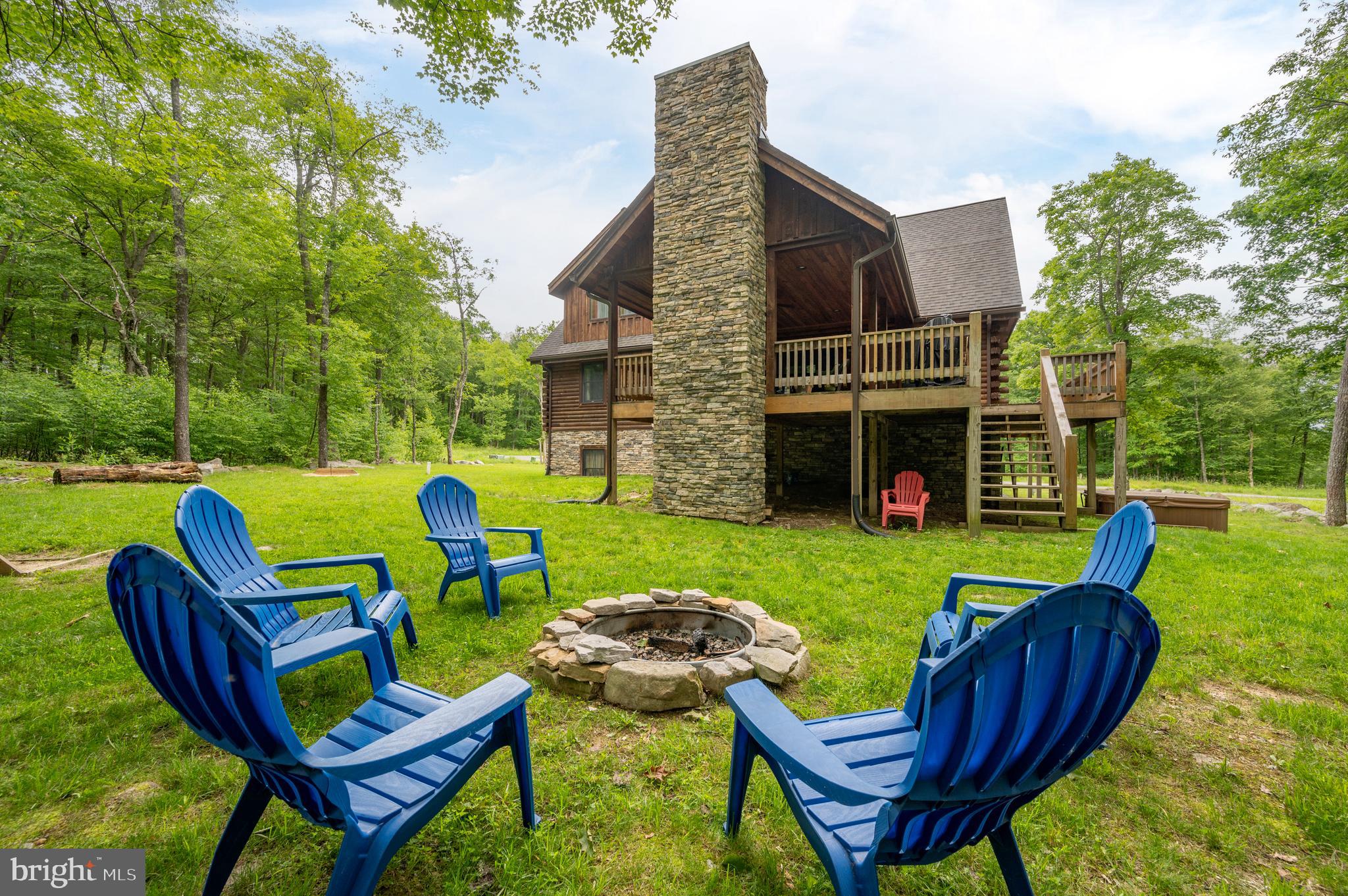 Located in the prestigious Greenbrier community on Lodestone Golf Course, this 6 bedroom, 5 full and 2 half bath home offers the perfect blend of luxury, comfort, and convenience. Just minutes from Wisp Resort and nestled in the heart of Deep Creek Lake, the property is a proven and successful vacation rental. Spread across three finished levels, the home features multiple ensuite bedrooms, two spacious living areas, a game room, gym space, and plenty of room to relax or entertain. Enjoy the enclosed back porch with an outdoor fireplace, or step outside to take advantage of the hot tub, horseshoe pit, fire pit, and more. Fishing/swimming access off of Marsh Hill Rd right on Deep Creek Lake! Whether you're seeking a personal retreat or an investment opportunity, this home offers it all with upscale finishes, an unbeatable location, and access to year-round recreation right outside your door!