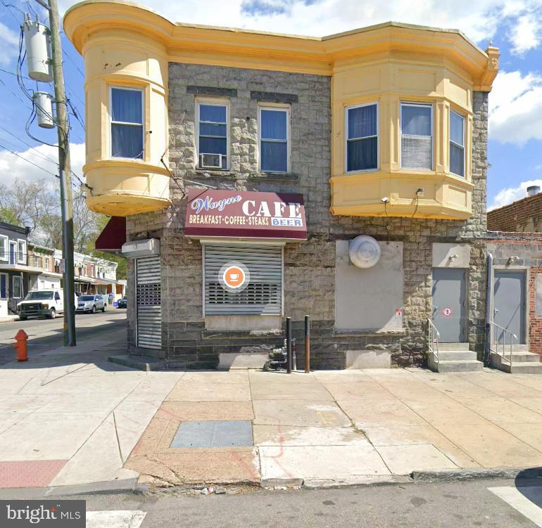 Positioned on a high-visibility corner lot with solid stone masonry construction, 4849-53 Wayne Ave is a standout mixed-use asset at the crossroads of Germantown Ave and Wayne Ave – one of the area’s most recognized commercial corridors. Built for an investor, owner-operator, or entrepreneur. 
The ground floor is a fully operational neighborhood café currently serving breakfast, coffee, steaks, and cold beer. The layout includes a commercial kitchen, offices, and restrooms – everything needed to continue operating. The cold beer sales permit/license status is to be confirmed with the seller. The basement provides ample storage, supporting efficient daily operations. 
Strong foot traffic, excellent visibility, and a flexible layout position this property for continued income or future expansion. A rare opportunity for buyers seeking an established business or long-term investment in a prime Philadelphia location.

Total consideration for the foregoing shall be the sum of Seven Hundred Twenty Thousand Dollars ($720,000), which shall be allocated as follows: Capital Stock $220,000, and Real Estate $500,000.