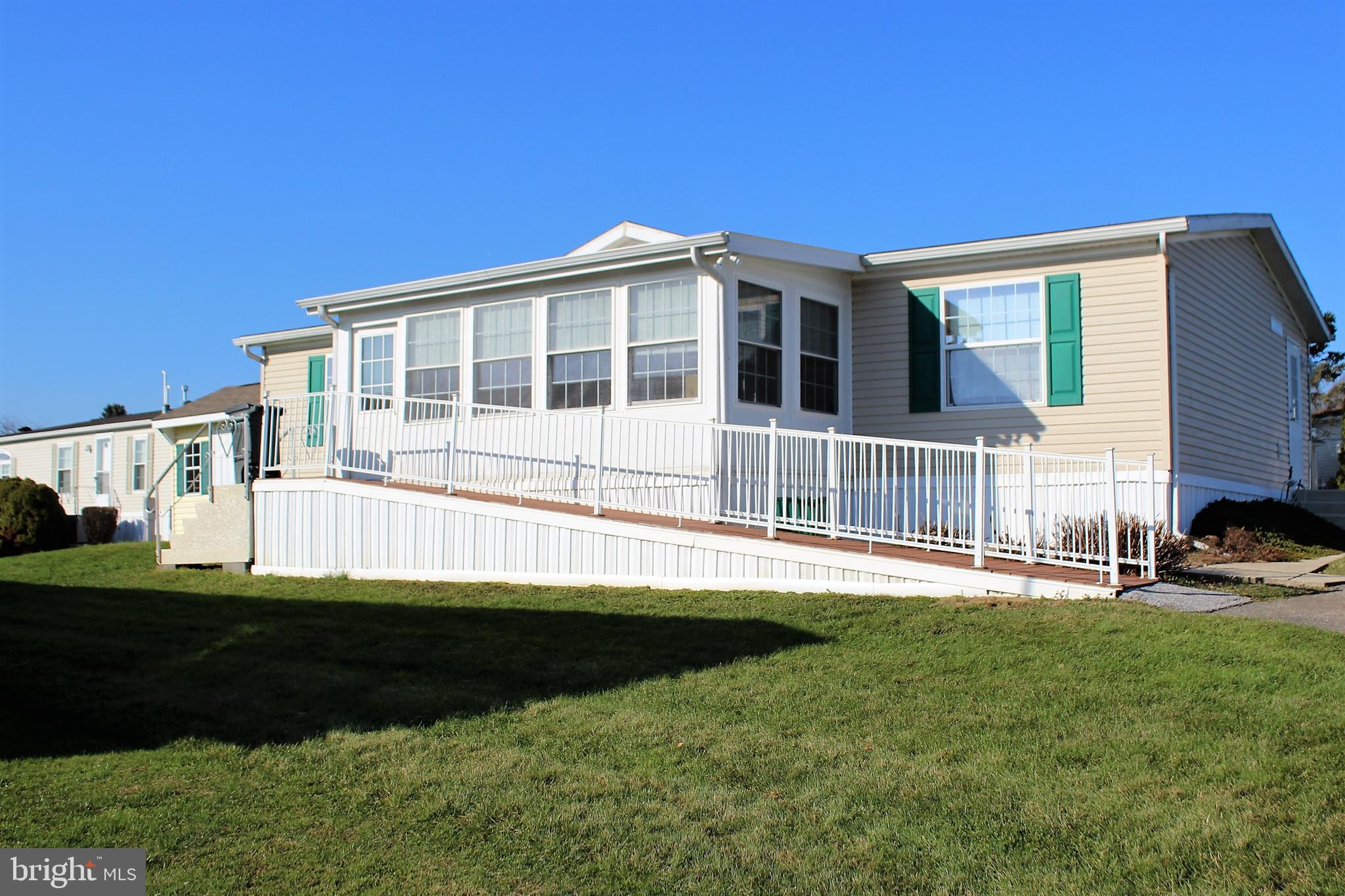 Well-kept 3 bedroom 2 bathroom manufactured home in Sunset Estates.  This home features a large, bright kitchen with an island as well as a bonus 3 seasons room.  Sunset Estates is a highly sought-after park with affordable land rent, which includes basic cable through Comcast, trash removal twice per week, and use of the in-ground community pool.  With a water softener, newer hot water heater, and a newer AC unit, this home is move-in ready!