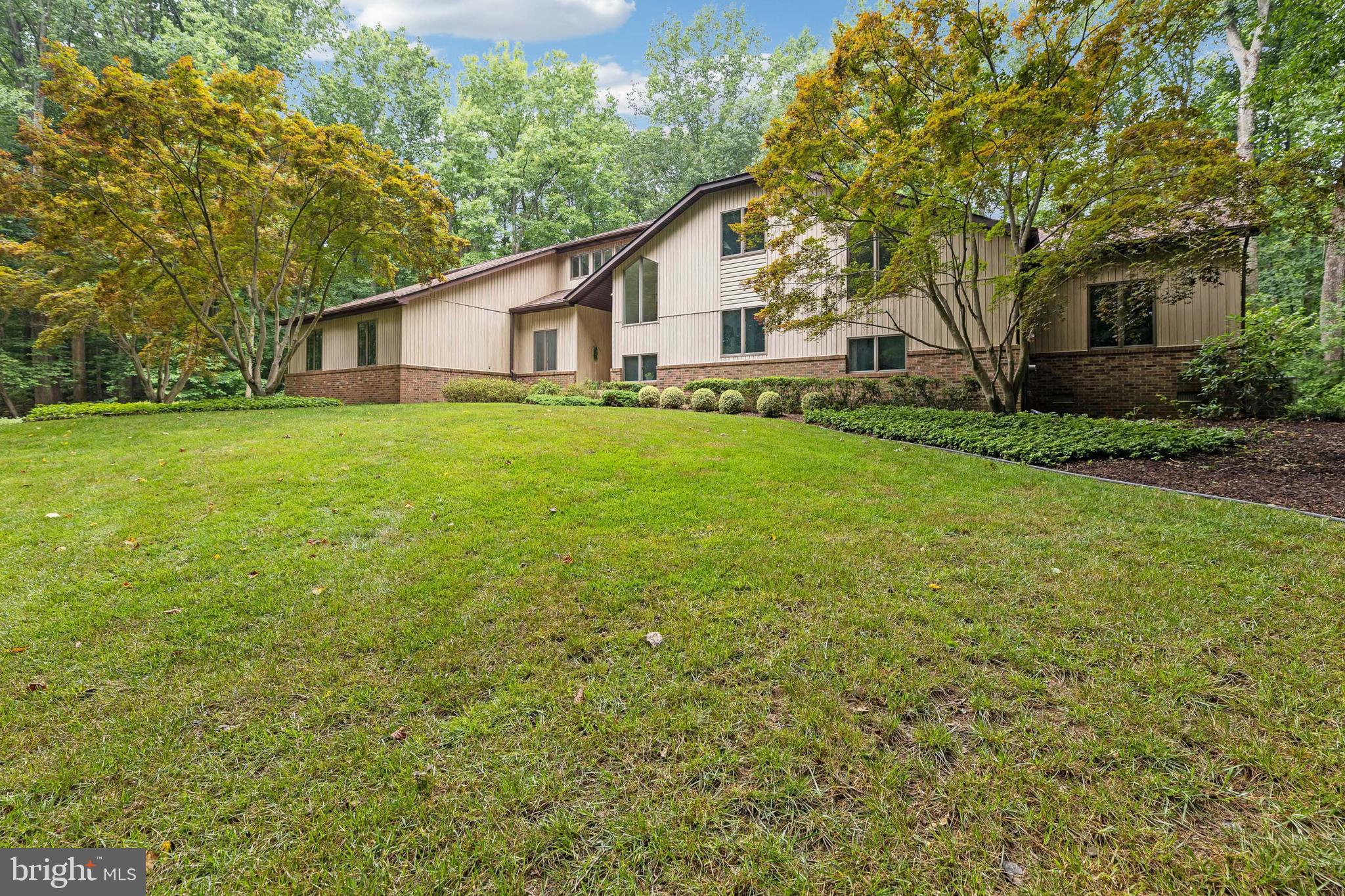 If you love privacy and lots of natural light, we have the home for you! Escape to your meticulously maintained home positioned on 5 acres in the sought-after community of Saint Leonard Shores.  With more than 4775 square feet of living space including 3 upper-level bedrooms, the main level primary bedroom suite, and the lower level with a full bathroom for a total of 4 bedrooms, 3 full and 1 half bathroom there is plenty of room for private or together time.  Scheduled to be active on or before July 1