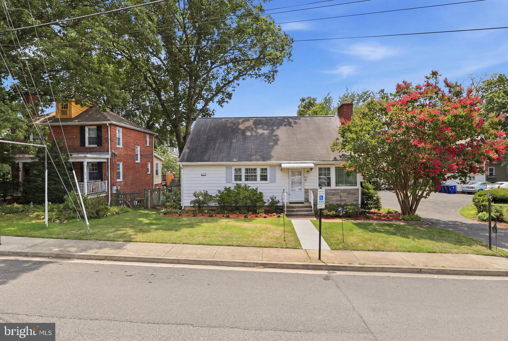 Price Correction.  Motivated seller.  Prepare to be impressed with this amazing home and opportunity to live in this coveted Arlington neighborhood. The home is much larger than it appears with almost 2800 sq ft of finished space on a premium 10,000 sq foot lot.  Multi-million dollar homes are being added frequently to this neighborhood because of the incredible location.  You are within walking distance of the Army Navy Country Club, a short drive to the Pentagon, Washington DC, Shirlington, DCA and all commuter routes.
The lot lends itself to an incredible expansion or a new custom build.  
The home offers a beautiful sun drenched living room with hardwood floors and a wood burning fireplace. The main level includes two massive bedrooms, an updated hall bathroom, a nicely proportioned dining room and an oversized galley kitchen.  Upstairs you will  find a large bedroom with a sitting area and the option to add another bathroom.  Downstairs you will discover a magnificent mid century modern full second kitchen with period correct fixtures and cabinetry.  It is like walking onto a movie set.  You have a massive custom walk-in closet, a cozy sun drenched living room, and a large fully legal bedroom with normal windows that allow ample natural light.  You have no steps to exit the rear of the home onto the patio (recently refreshed with new epoxy) and a large rear garden.  The home offers a detached garage with a "shared" driveway with the neighbor.  The driveway provides an easement for both properties to have access to their respective homes.  The beauty of this home is that it is very liveable and could easily offer a rental income/adu in the basement.   It is perfect for a mother-in-law suite, or an au pair setup.
The options for enlargement or a new luxury home are endless.  Please come join us this Saturday or Sunday for an open house!