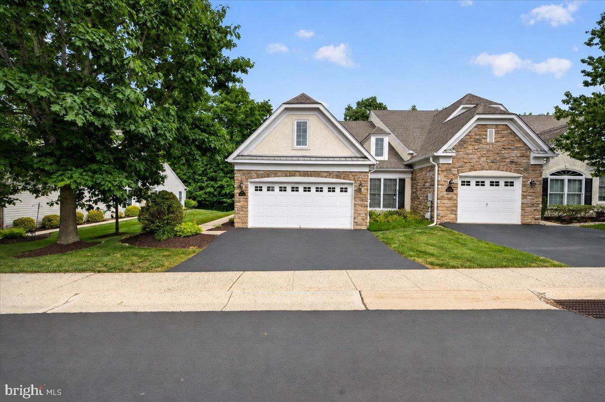 Welcome Home To This Beautiful Carriage Home In The Sought-After HARRINGTON VILLAGE Community In Franconia Township, Souderton, PA; This End-Unit Residence Offers A Spacious And Open Layout, Featuring A Bright Living Room With Fireplace, Cathedral Ceiling & Chair Rail, Dining Room With Bump Out & Crown Molding, Kitchen With Dishwasher, Disposal, Electric Stove, Pantry, Microwave & Refrigerator; Enjoy Natural Light Year-Round In The Sunroom, Complete With Sliding Glass Doors To A Private Patio, Ideal For Relaxing Or Hosting Guests, Primary Bedroom With Walk-In Closets, Primary Bedroom Bath With Double Vanity, Walk-In Shower With Tile Floor, A Second Nice Size Bedroom, Full Hall Bath With Tub & Shower And A Laundry Area Rounds Out The First Floor; Enjoy The Fully Finished Loft Area That Provides Flexible Space For A Home Office, Guest Area Or Additional Living Space; Additional Highlights Include A Two-Car Garage And A Premium Lot Backing Up To Woods And A Scenic Walking Trail, Offering Both Privacy And A Connection To Nature; This Is Low Maintenance Living At Its Finest In A Truly Picturesque Setting.