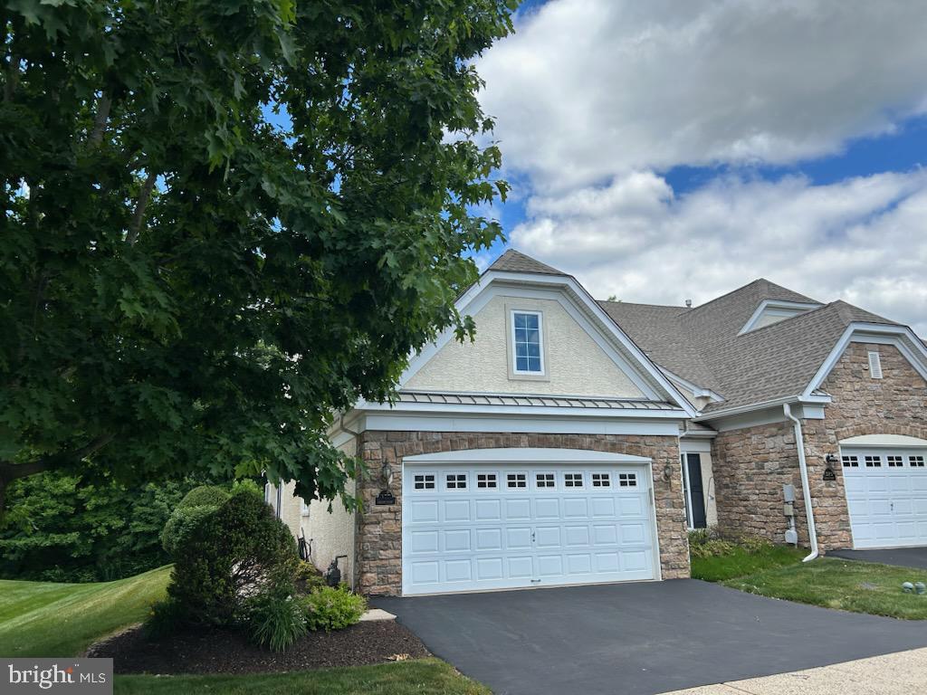 Welcome Home To This Beautiful Carriage Home In The Sought-After HARRINGTON VILLAGE Community In Franconia Township, Souderton, PA; This End-Unit Residence Offers A Spacious And Open Layout, Featuring A Bright Living Room With Fireplace, Cathedral Ceiling & Chair Rail, Dining Room With Bump Out & Crown Molding, Kitchen With Dishwasher, Disposal, Electric Stove, Pantry, Microwave & Refrigerator; Enjoy Natural Light Year-Round In The Sunroom, Complete With Sliding Glass Doors To A Private Patio, Ideal For Relaxing Or Hosting Guests, Primary Bedroom With Walk-In Closets, Primary Bedroom Bath With Double Vanity, Walk-In Shower With Tile Floor, A Second Nice Size Bedroom, Full Hall Bath With Tub & Shower And A Laundry Area Rounds Out The First Floor; Enjoy The Fully Finished Loft Area That Provides Flexible Space For A Home Office, Guest Area Or Additional Living Space; Additional Highlights Include A Two-Car Garage And A Premium Lot Backing Up To Woods And A Scenic Walking Trail, Offering Both Privacy And A Connection To Nature; This Is Low Maintenance Living At Its Finest In A Truly Picturesque Setting.
