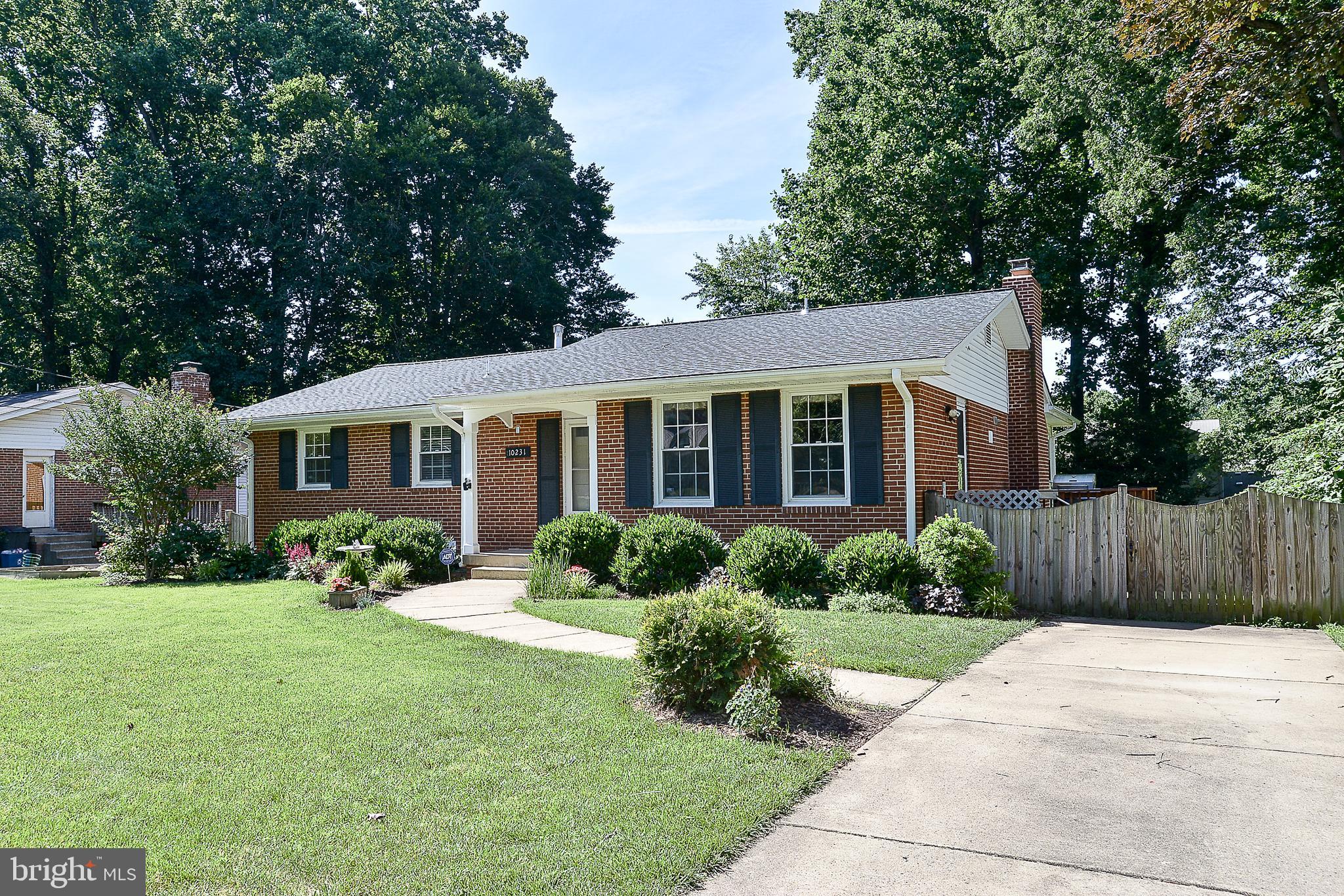 Beautiful 5BR 3BA rambler in sought after Mosby Woods. Wonderful home with updates throughout! Updated eat-in kitchen with corian countertops, stainless steel appliances, hardwood flooring, recessed lighting & lots of cabinet space! Large sunroom addition & screened porch. Finished basement boasts 2 large BR's, full bath, must-see laundry room & large family room with wood burning fireplace, walkout to private patio.  Huge fenced rear yard. Lots of parking. Near Fairfax City - shopping and restaurants. Easy bus ride to metro. Professionally managed