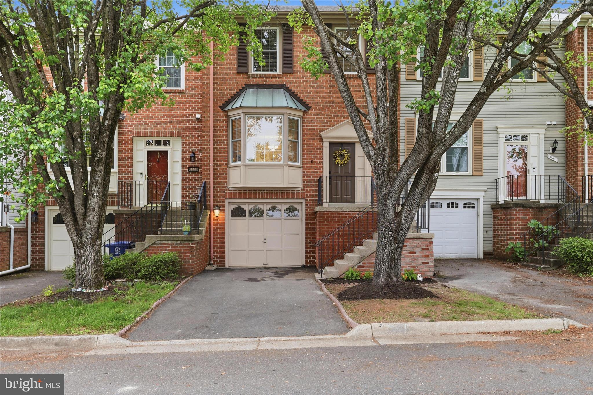 Offer deadline Sunday, May 3, 2026 at 10am.
Welcome home to this beautifully maintained brick-front townhome in the highly desirable Roxboro community of Leesburg! Offering three finished levels and over 1,800 square feet of living space, this move-in ready home combines comfort, style, and an unbeatable location.
The main level features a bright and inviting living and dining room combination with hardwood flooring, crown molding, chair rail detail, and a charming bay window that fills the space with natural light. Just a few steps away, the eat-in kitchen features new stainless steel appliances, granite countertops, and new luxury vinyl plank flooring, with a sliding glass door leading to a large, freshly stained deck—perfect for entertaining or relaxing outdoors.
Upstairs, the primary suite impresses with a vaulted ceiling, walk-in closet, and a private bath complete with a tub and separate shower. Two additional bedrooms and a full bath provide comfortable accommodations for family or guests. 
The fully finished lower level offers even more living space with a versatile family room, ceramic tile flooring, a half bath, and a dedicated laundry room with a wood burning fireplace with direct access to the one-car garage. A walk-out slider leads to a patio and fenced backyard, creating a great space for indoor-outdoor living.
Recent updates include fresh interior and exterior paint, a new 45-gallon water heater, lighting and plumbing fixtures and toilets, garbage disposal and major systems including the HVAC and roof replaced in 2018. The fireplace conveys as-is and has not been used by the current owner.
Ideally located near major commuter routes 7 and 15, downtown Leesburg, shopping, dining, top-rated schools, Dulles and Leesburg airports and the W&OD Trail, this home offers the perfect blend of lifestyle and location!