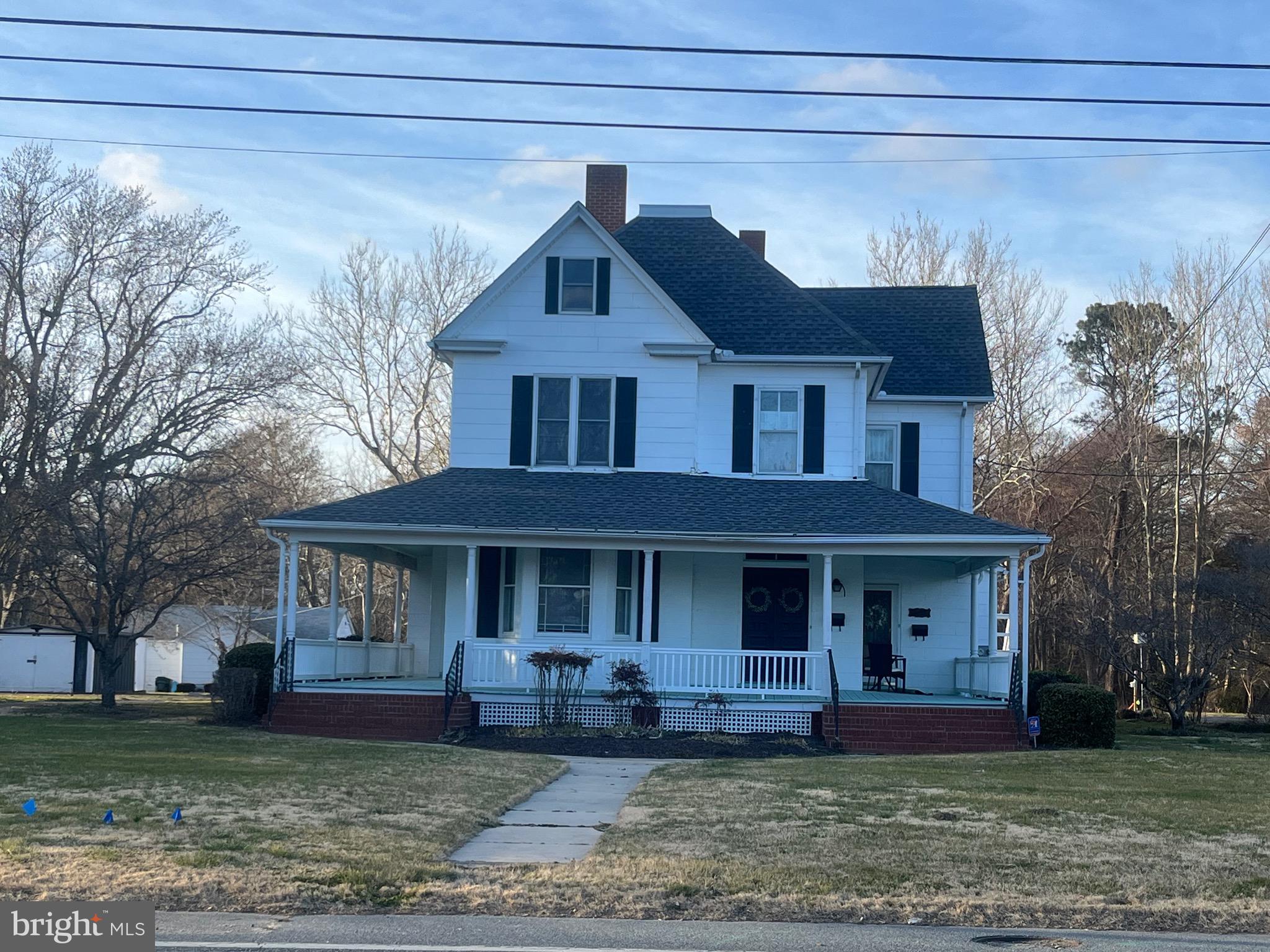 Spacious home, currently divided into 2 apartments with additional 1 bedroom cottage located at back of property.  2 Car detached garage, and 3 other detached sheds with electric. sitting on approximately 8 acres of land that backs to the Pocomoke River.