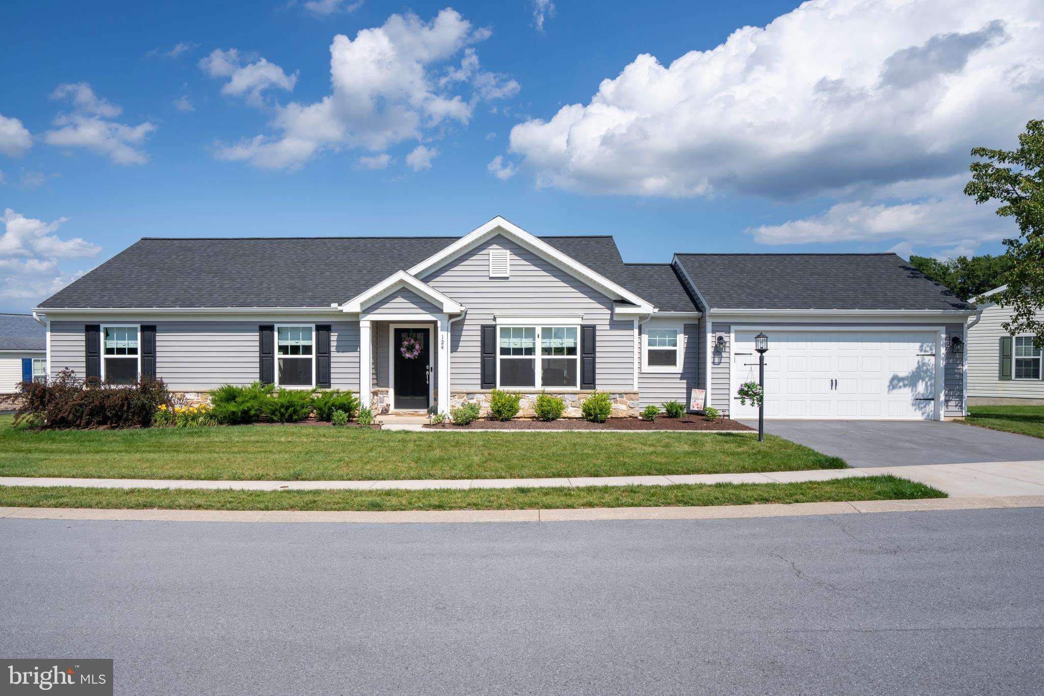 Comfort and convenience with all the essentials on one floor at this 3 bedroom, 2 bath ranch with 1,500 sqft in Nittany Glen! This lovingly maintained home built by Berks in 2023 boasts a fantastic open floor plan with living, dining and kitchen all together for optimal entertaining and quality LVP flooring throughout. The sleek kitchen offers granite countertops, a center island, stylish lighting and pantry. The primary bedroom has a full ensuite bath featuring dual sink vanity and walk-in closet. Step out to the beautiful composite deck — the perfect spot to relax and enjoy the fresh air. The home’s placement on this curved lot gives the backyard a more open, private feel. A mudroom and laundry room sit off the oversize 2-car garage adding convenience and additional storage options. Nittany Glen residents enjoy use of the clubhouse, fitness center, pool and more! True main‑floor living with the ease of common‑area maintenance, lawn care, snow removal, and trash service are all handled by the COA. This home won't last long — schedule your tour today!