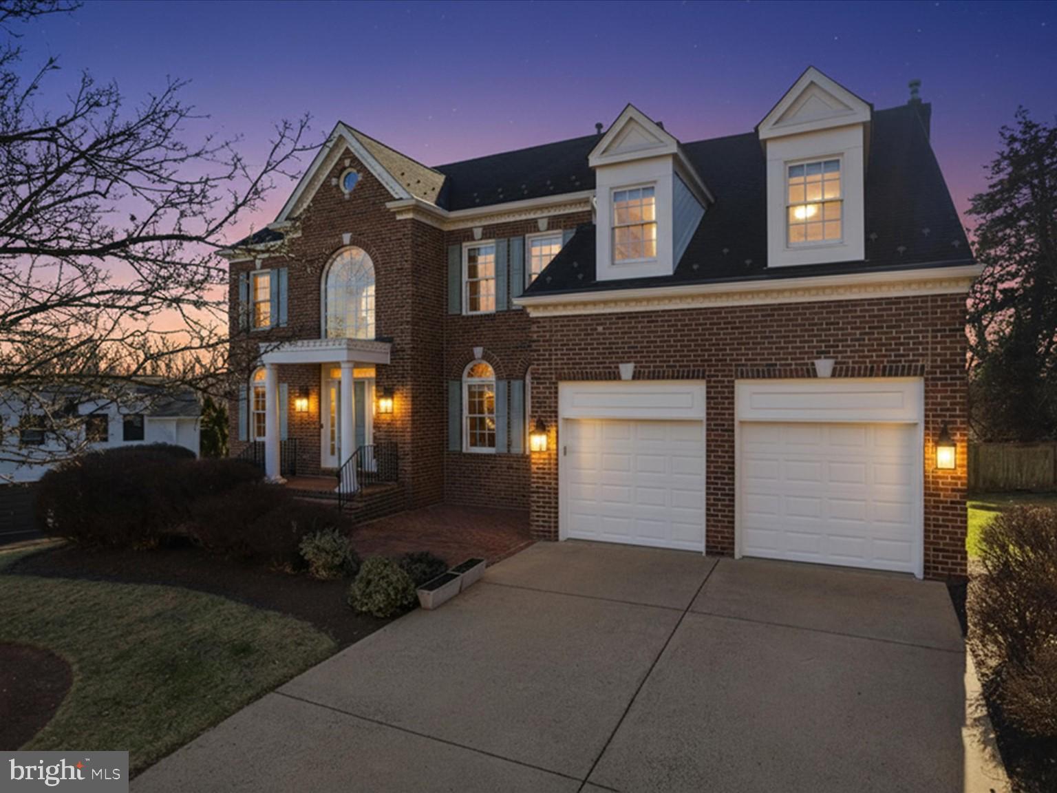 *OFFERS DUE SUNDAY 9PM* Tucked away on a quiet cul de sac, 2310 Colonel Lindsay Court delivers timeless Colonial architecture paired with today’s most sought after upgrades, all just minutes from I-66, Tysons Corner, and the region’s premier destinations. This home is also adjacent to the brand new Ruckstuhl Park, a thoughtfully planned neighborhood green space featuring walking trails, open lawns, a nature-inspired playground, and preserved woodland, offering a peaceful extension of daily living.

From the moment you enter, a dramatic two story foyer with a graceful curved staircase sets a refined first impression. Sunlight washes across hardwood floors spanning two levels, creating a cohesive and sophisticated flow throughout the main living spaces. The gourmet, fully updated kitchen serves as the heart of the home, featuring thoughtful cabinet pull outs for optimal functionality and seamlessly opening to the family room with a gas fireplace, perfectly suited for both elevated entertaining and everyday living. A private library with a full wall of custom built ins offers flexibility for a home office, study, or quiet retreat.

Upstairs, the owner’s suite is a true sanctuary, highlighted by vaulted ceilings, a sitting area, multiple closets, and a brand new spa inspired bath designed for relaxation and indulgence. Every bathroom in the home has been tastefully updated, reinforcing a consistent, high end aesthetic throughout.

The walk out lower level extends the living experience with intention and versatility, offering new designer flooring, a statement wet bar, a spacious bedroom and full bath, a recreation room, and a dedicated exercise space ideal for guests, extended living, or wellness at home.

Designer finishes elevate every detail, including new light fixtures, curated wallpaper, custom molding in the living and dining rooms, fresh paint throughout, and built ins in the garage for smart storage. A Tesla charger already installed in the garage adds a forward thinking convenience for modern living.

Ideally positioned near Trader Joe’s, Tysons Corner, the Mosaic District, Downtown Falls Church, and with easy access to Washington, DC, this home delivers both lifestyle and location. This is a rare opportunity to own a truly turnkey residence in one of Northern Virginia’s most connected and desirable settings.