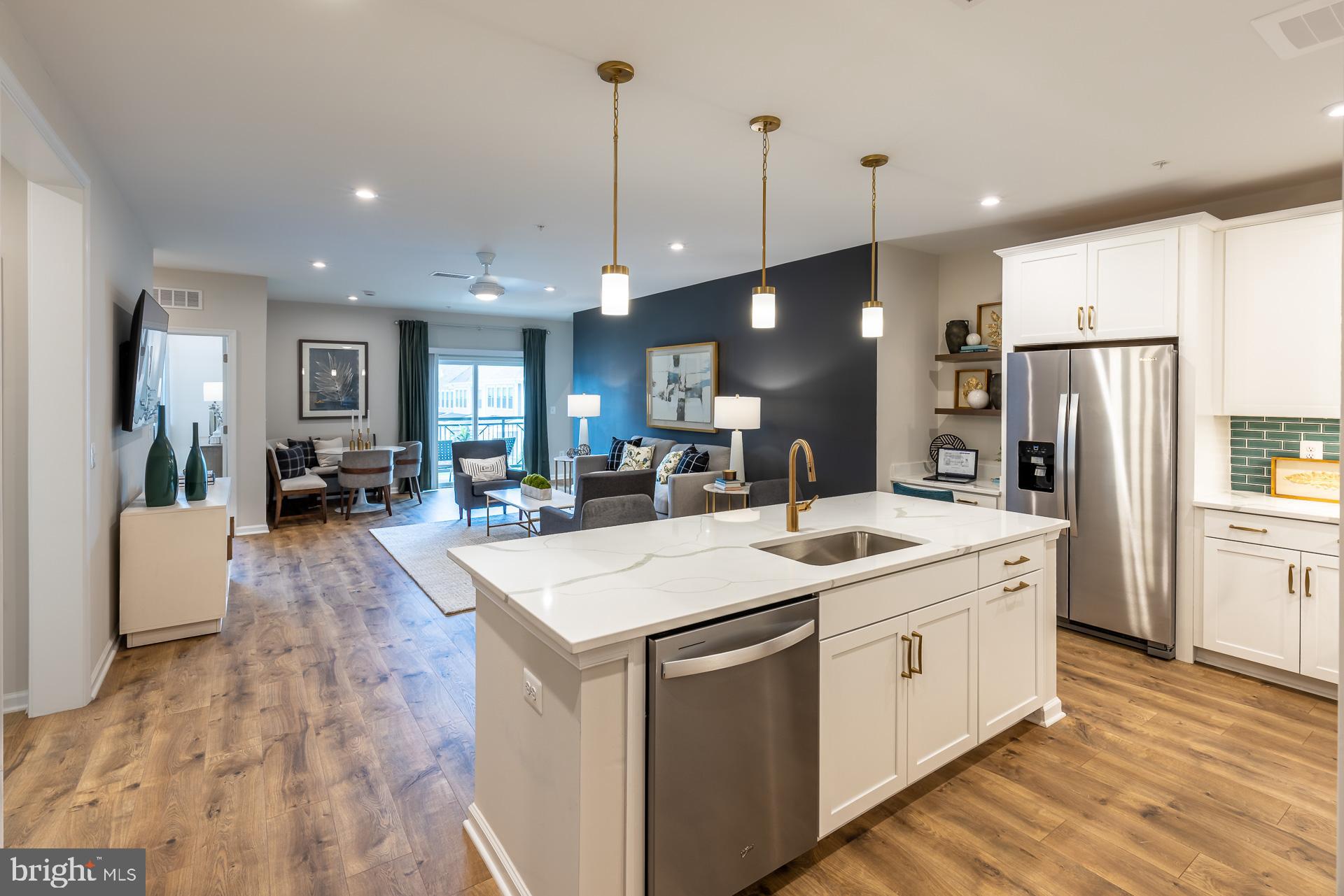 Ready for June Move in!! Find Your Perfect Fit at Gatherings at Cabin Branch. Whether you're looking to elevate, downsize, or rightsize your lifestyle, this 55+ community in Clarksburg offers the perfect balance of comfort and convenience. Choose from five stylish condo floorplans with elevator access and enjoy amenities like a billiards room, gym, golf simulator, and more. Join community events at the clubhouse or explore Clarksburg Outlets for shopping and dining. At Gatherings at Cabin Branch, you’ll be close to everything that matters most—daily conveniences, top-tier amenities, and cherished connections. Move-In Ready!!! Enjoy over 1,500 sq. ft. of living space, including a spacious kitchen featuring a walk-in pantry and breakfast bar. The living room and dining area provide plenty of space for entertaining and grant access to each bedrooms, as well as the private balcony. The sizeable secondary bedroom offers a walk-in closet, where as the primary suite provides two closets and a spa-inspired bath with an oversized shower and seat! Included features: Elevator Access, 1-car garage, laundry package (washer and dryer), spacious kitchen island with center sink, designer hardwood flooring in select rooms, dual vanities in the primary bath. This home is rated Energy Series PLUS, meaning you receive enhanced construction features that deliver a tighter, more efficient home. In addition to being ENERGY STAR certified and Indoor airPLUS qualified, this home has higher performing low-e windows, HVAC equipment and ductwork in conditioned space, and more – saving you tons of money each month on utilities! ** Photos of the model home. *Pricing, features and, availability subject to change without notice. MHBR No. 93  2023 Beazer Homes.
