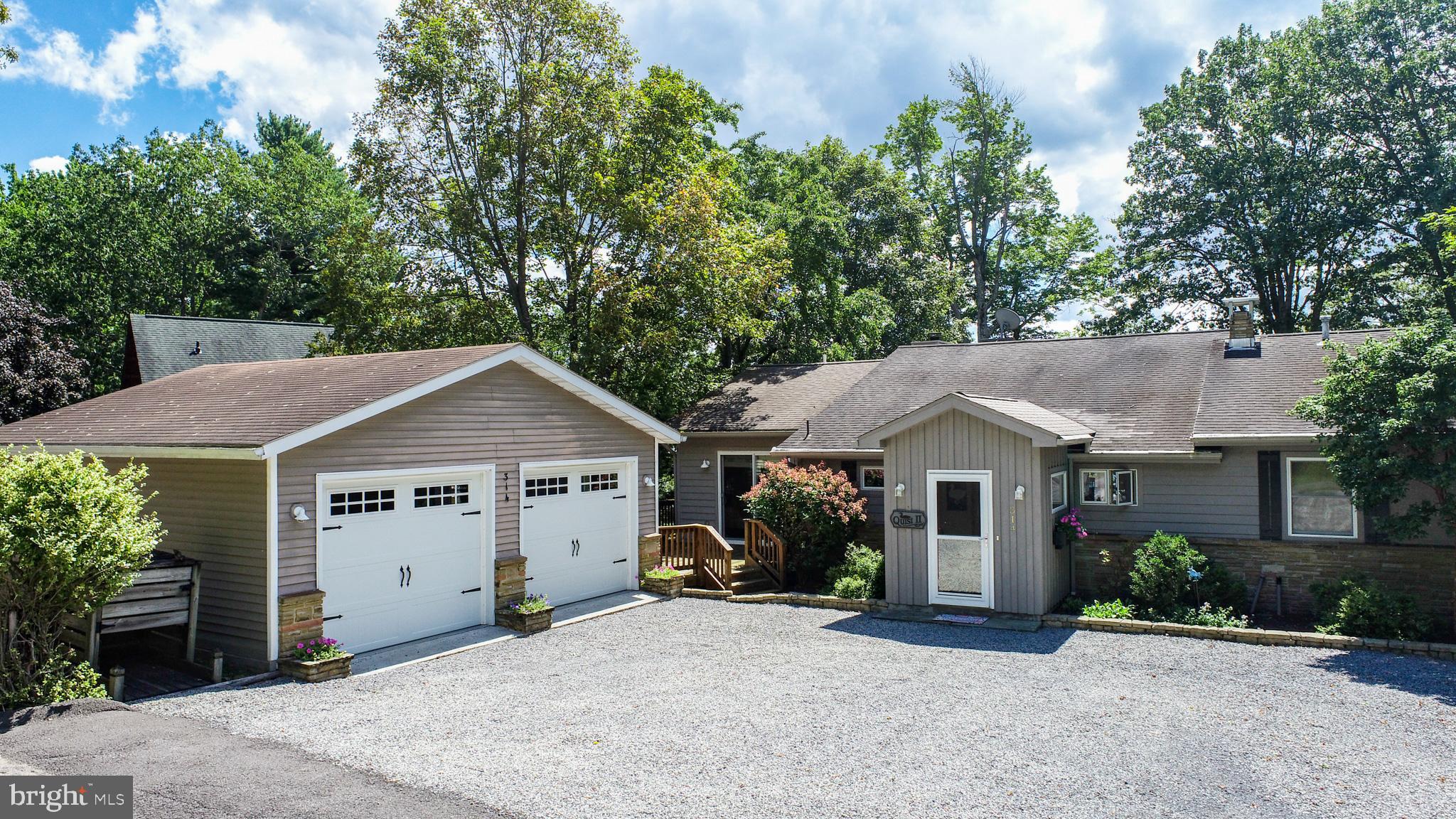 With 6 bedrooms, 5 bathrooms, and nearly 4,000 square feet of beautifully finished living space, this renovated and expanded home offers an unparalleled waterfront lifestyle along 100 feet of coveted flat lake frontage. Vaulted ceilings with exposed wood beams elevate the main living areas, highlighted by a striking wood-burning fireplace with a custom hand hewn wood mantle from an old barn, and hand picked stones by the owner from a local quarry.

The open kitchen boasts custom built-ins and high-end newer appliances (refrigerator 2023, stove 2023, dishwasher 2024), while the serene primary suite features custom built-ins, walk-in closet and seamless access to an expansive  private deck with sweeping lake views. 

Enjoy 4 bedrooms and 4 bathrooms on the main floor and a spacious walkout lower level with 2 bedrooms, 1 bathroom enhances the home’s versatility with abundant space for entertaining and guests. The lower level also features a pot belly wood stove, an abundance of storage space and access to the professionally landscaped 0.57 acre lot with gorgeous lake views. 

Designed for both luxury and leisure, the property includes a Type A dock, wave runner ramp, hot tub,  ductless AC system (2023) and a detached expanded two-car garage with 110 and 240 volt outlets.  Every detail reflects quality and craftsmanship, making this an extraordinary lakefront retreat. 

The location is on a quiet dead end street and you are less than 5 min drive to Arrowhead Market, the famous HoniHoni Bar, Unos Pizza and a short boat ride to The Creamery Ice Cream store! Welcome home to lakefront living at its best.